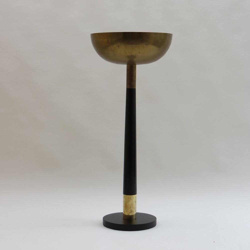 Wonderful vintage Modernist Baptismal font. This piece is made from solid brass and ebonized Mahogany with painted cast iron base and dates from the 1970s. Originally used as a portable baptismal font, it breaks down into 3 sections, cast iron base,