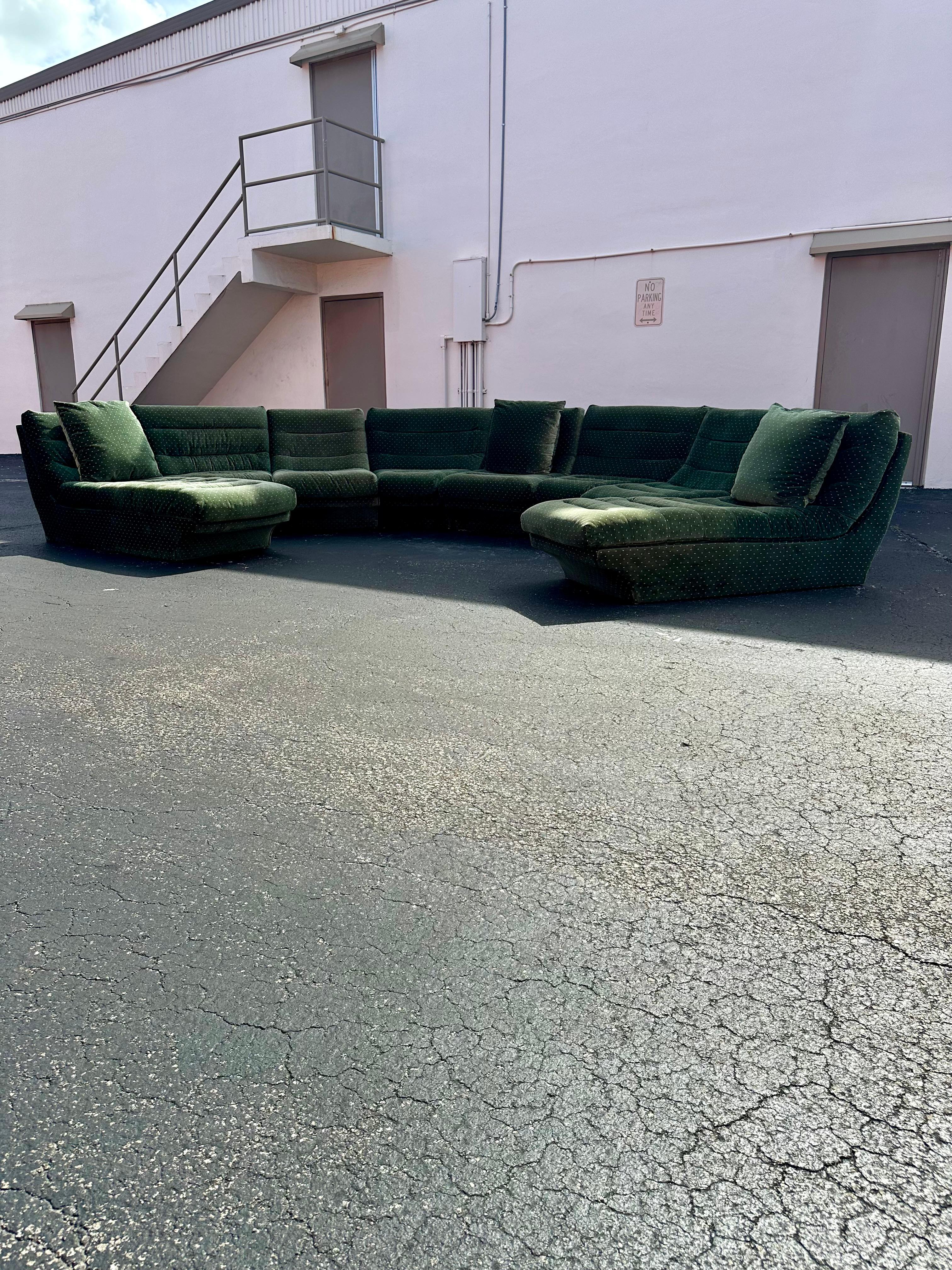 Transport yourself back to the sleek and sophisticated 1970s with this exquisite modular, luxurious forest green, cotton velvet blend upholstery, 8 pieces chaise sectional sofa. The ultra rare sectional exudes an air of luxury and refinement.