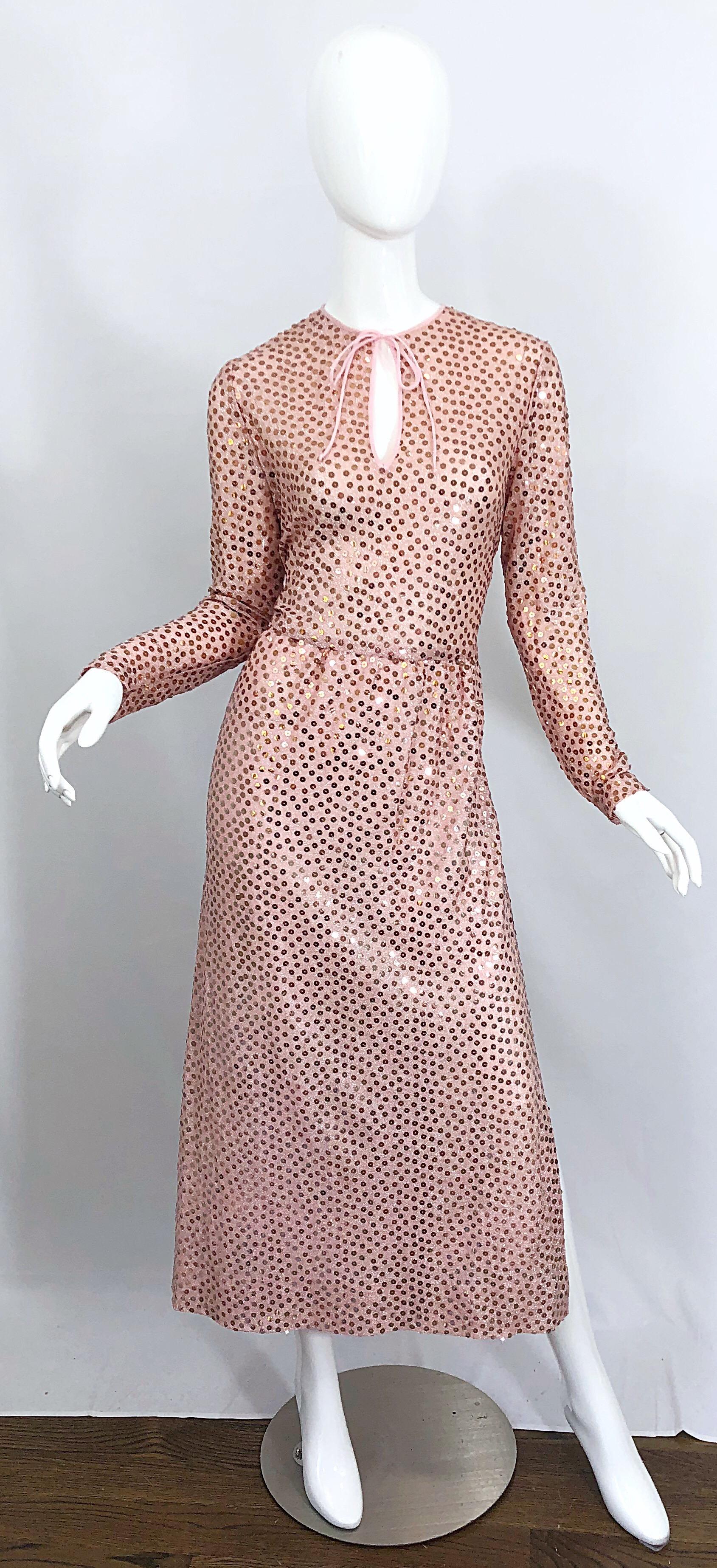 Beautiful 1970s MOLLIE PARNIS pink lurex evening dress! Features thousands of hand-sewn rose gold sequins throughout. Hidden zipper up the back with hook-and-eye closure. Keyhole opening at center neck ties shut with two pink chiffon ties. Slit up