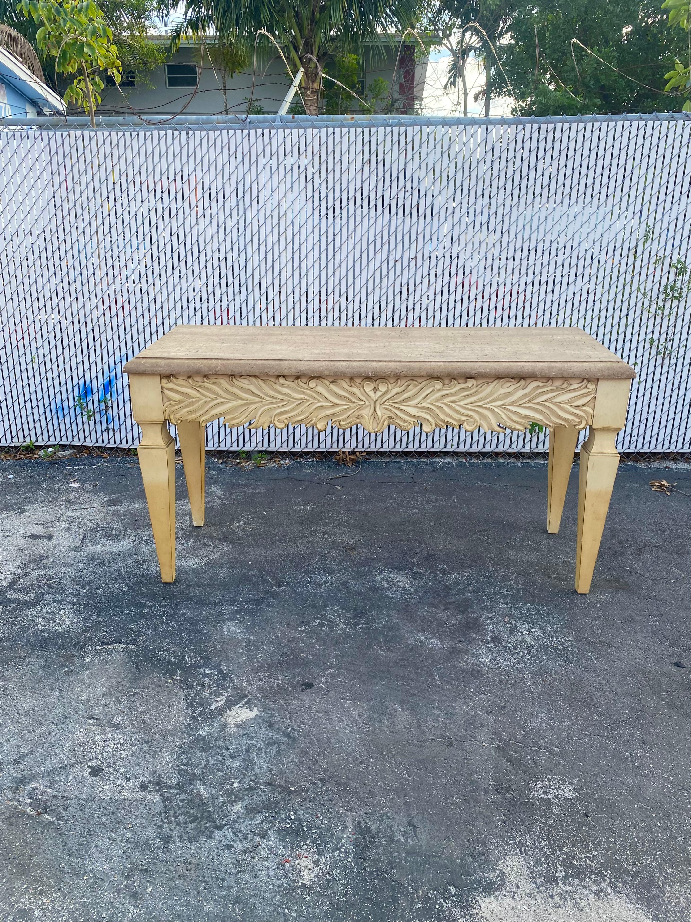 On offer on this occasion is one of the most stunning, rare, travertine top, carved wood console table or desk you could hope to find. Outstanding design is exhibited throughout. The beautiful table is statement piece and packed with personality!!