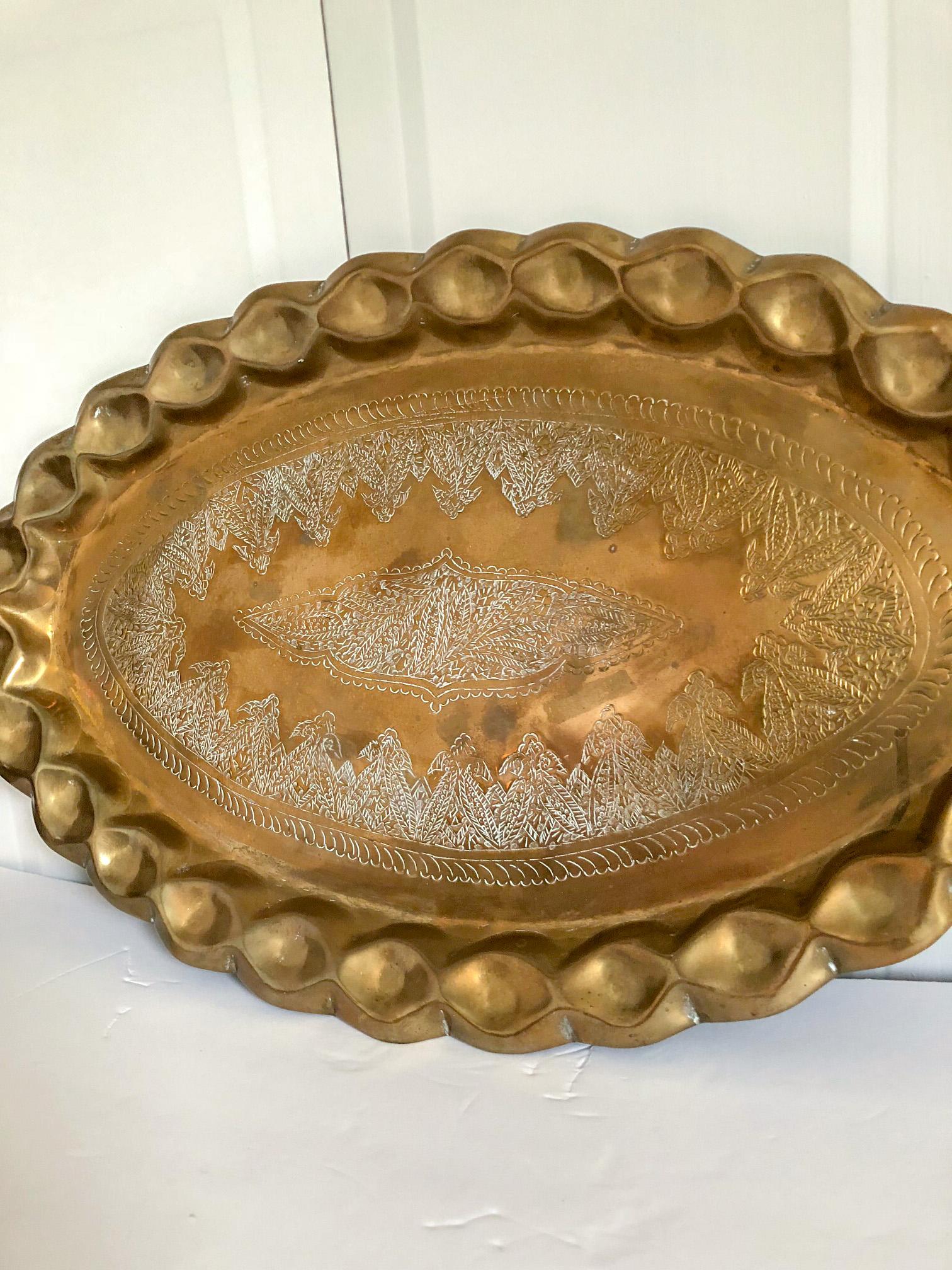 Wonderful old solid brass Moroccan oval tray in an unusual oval size. Natural brass age patina as shown. Measures: 24