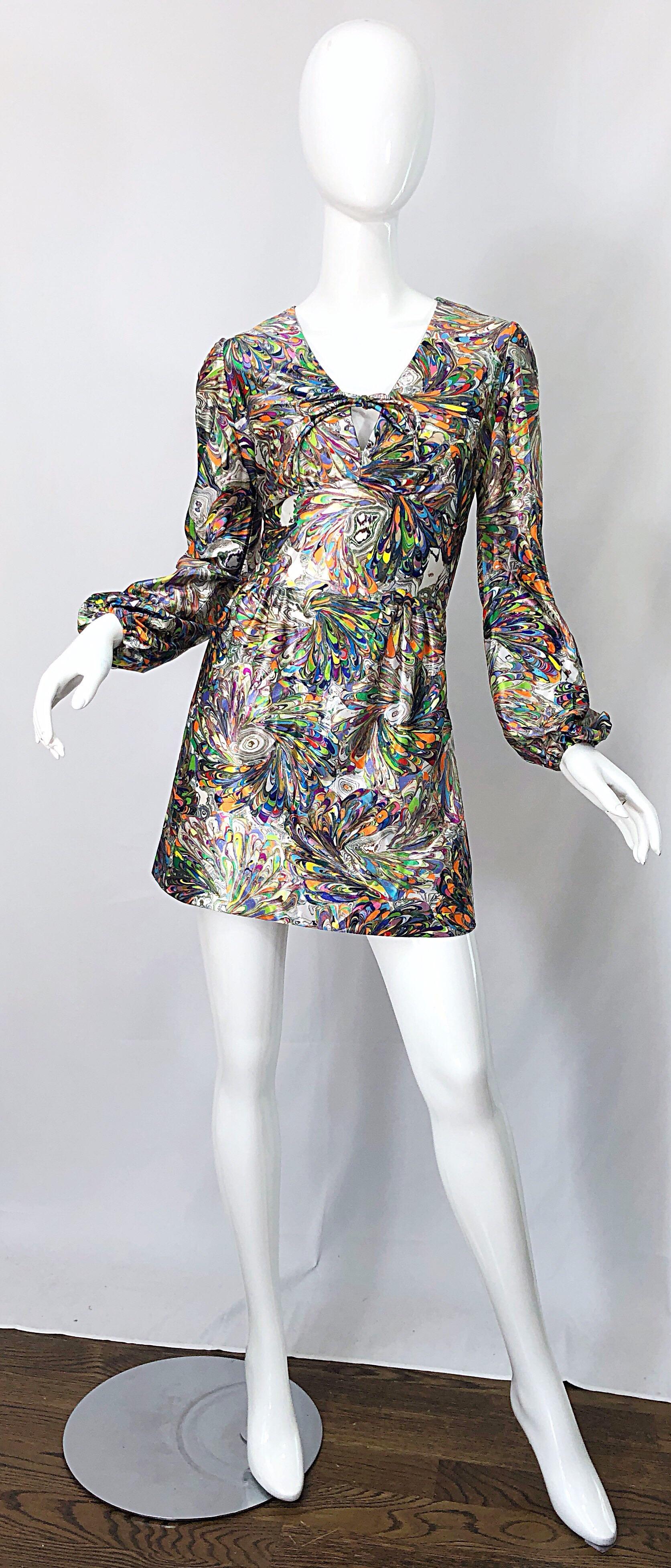 Amazing early 70 vibrant color mosaic swirl print bishop sleeve mini dress or tunic top ! Features a bright rainbow colors of purple, blue, neon green, orange, yellow, hot pink, and white throughout. Ties at center bust. Hidden zipper up the back