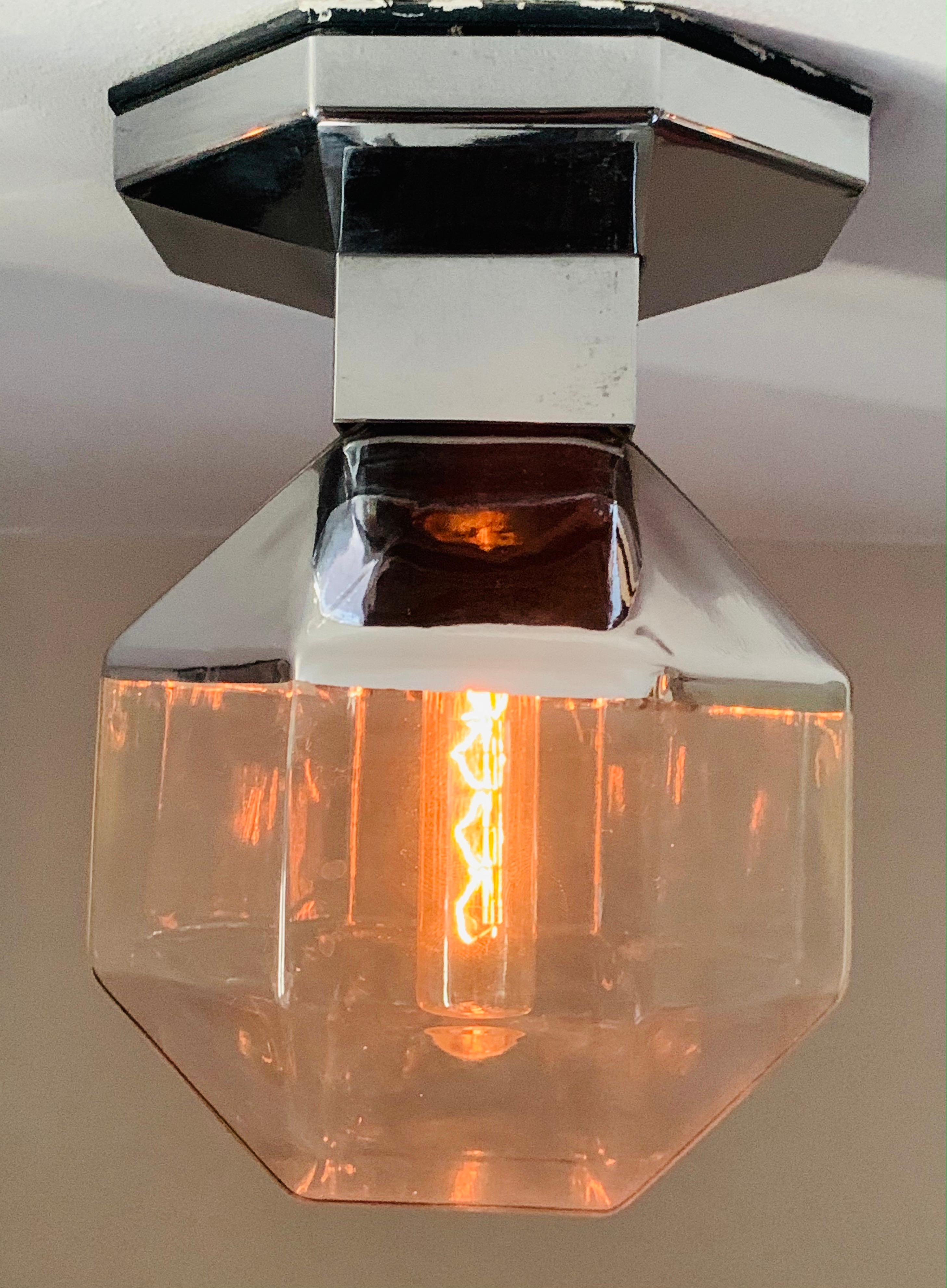 Stunning vintage wall lights, sconces or ceiling flush lights designed by Motoko Ishii for Staff Leuchten during the 1970s. The hexagonal chrome-plated metal fitting holds the single E14 screw in bulb. As you can see from the images the lightbulb is