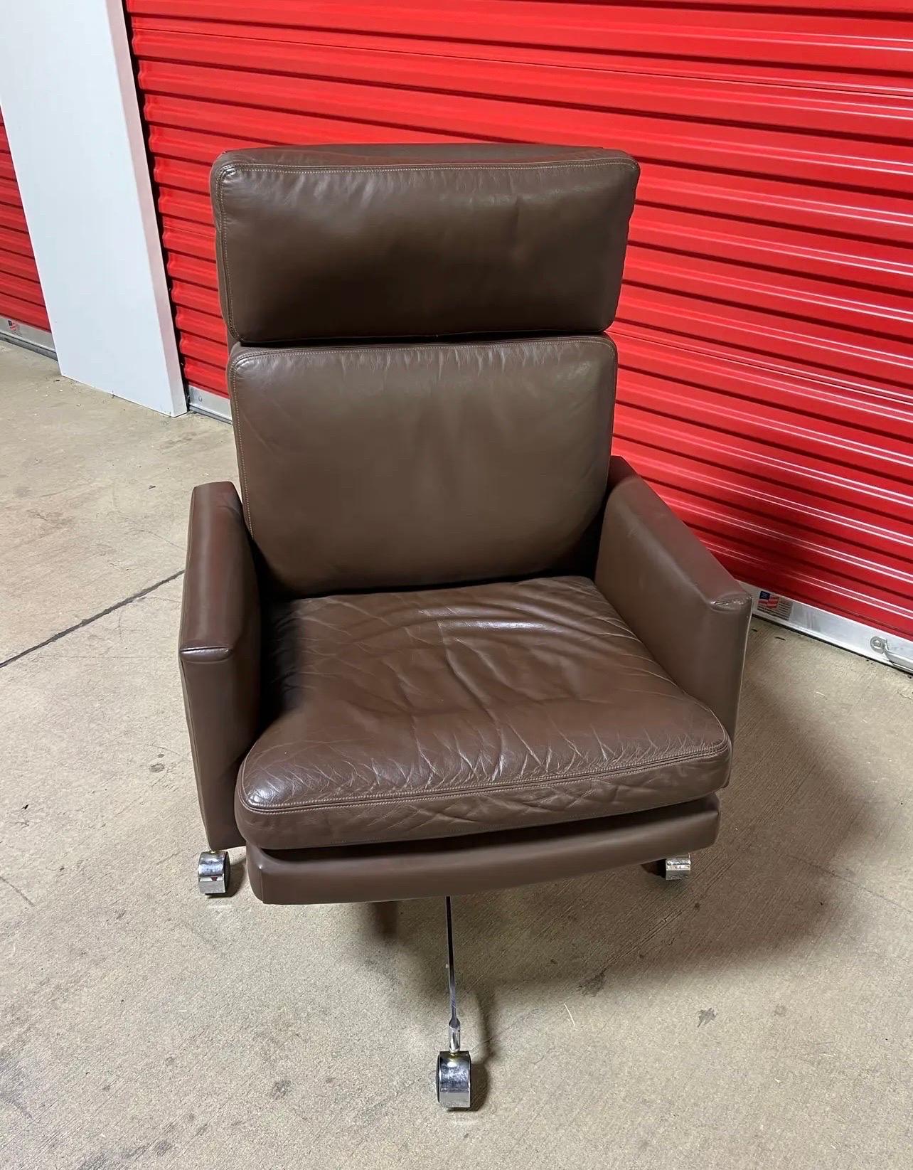 For sale is a rare and hard-to-find chair crafted by Mueller. This chair boasts exceptional craftsmanship and high-quality materials. It features a luxurious leather upholstery paired with a sturdy metal base, ensuring both style and durability. The