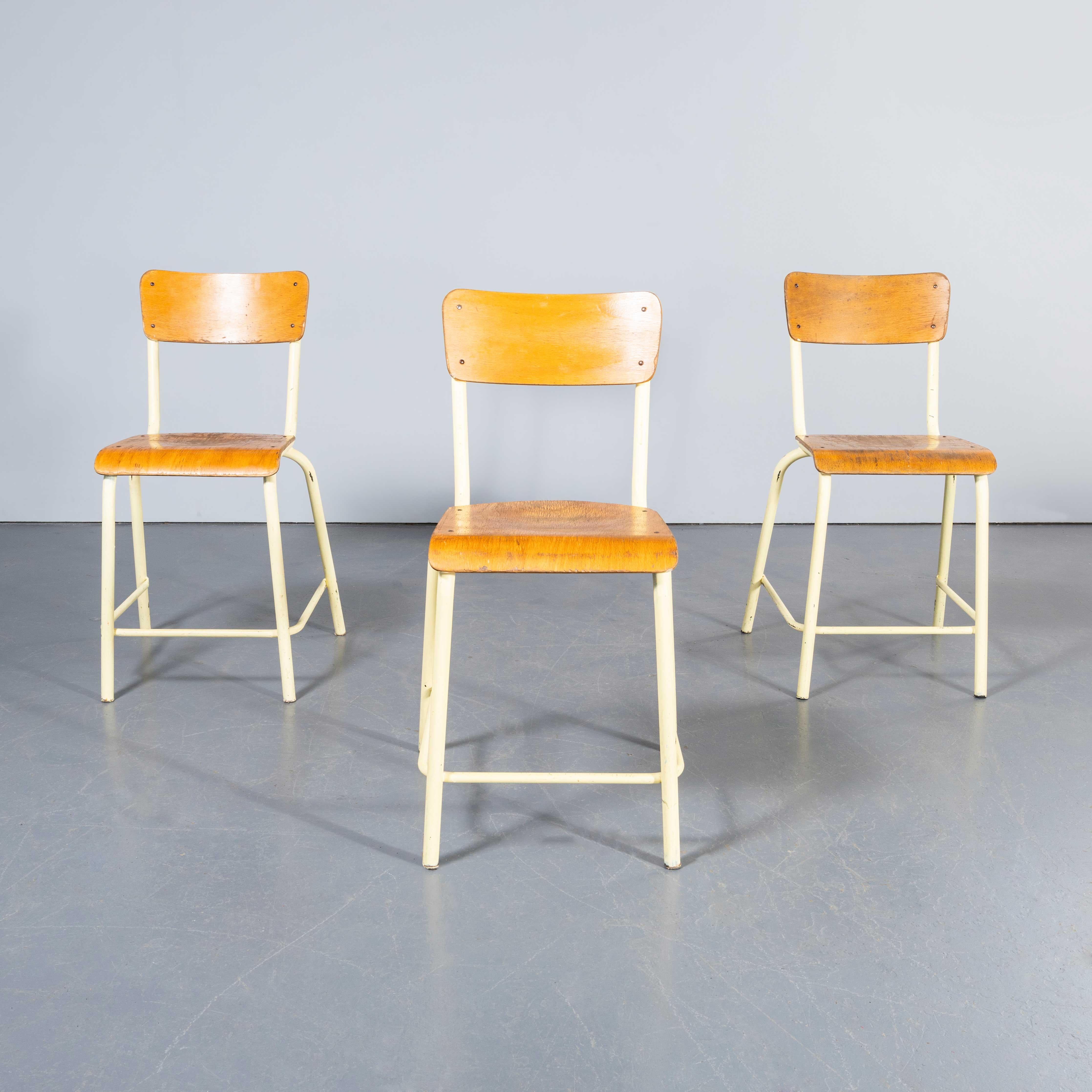 1970's Mullca High Laboratory Yellow Dining Chairs - Bar Stools - Set Of Three. 
One of our most favourite chairs the higher seat (53 cm) laboratory high chairs made by Mullca, with the foot rest on three sides. In 1947 Robert Muller and Gaston