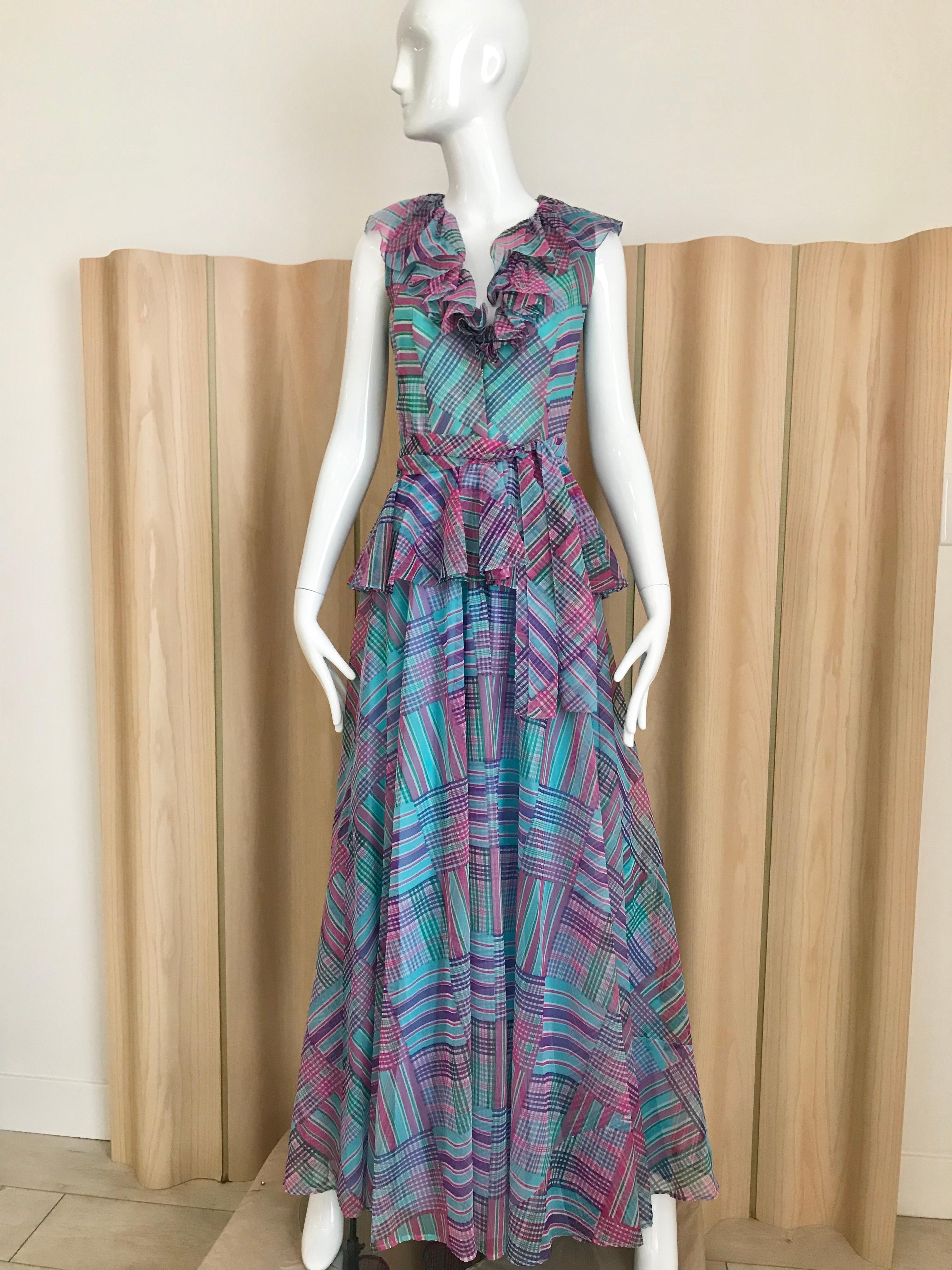 Vintage 1970s multi color ( pink, blue, green plaid ruffle V neck sleeves maxi dress.
Size: Medium
Bust: 38 inches / Waist: 28 inches/ Dress length: 60 inches