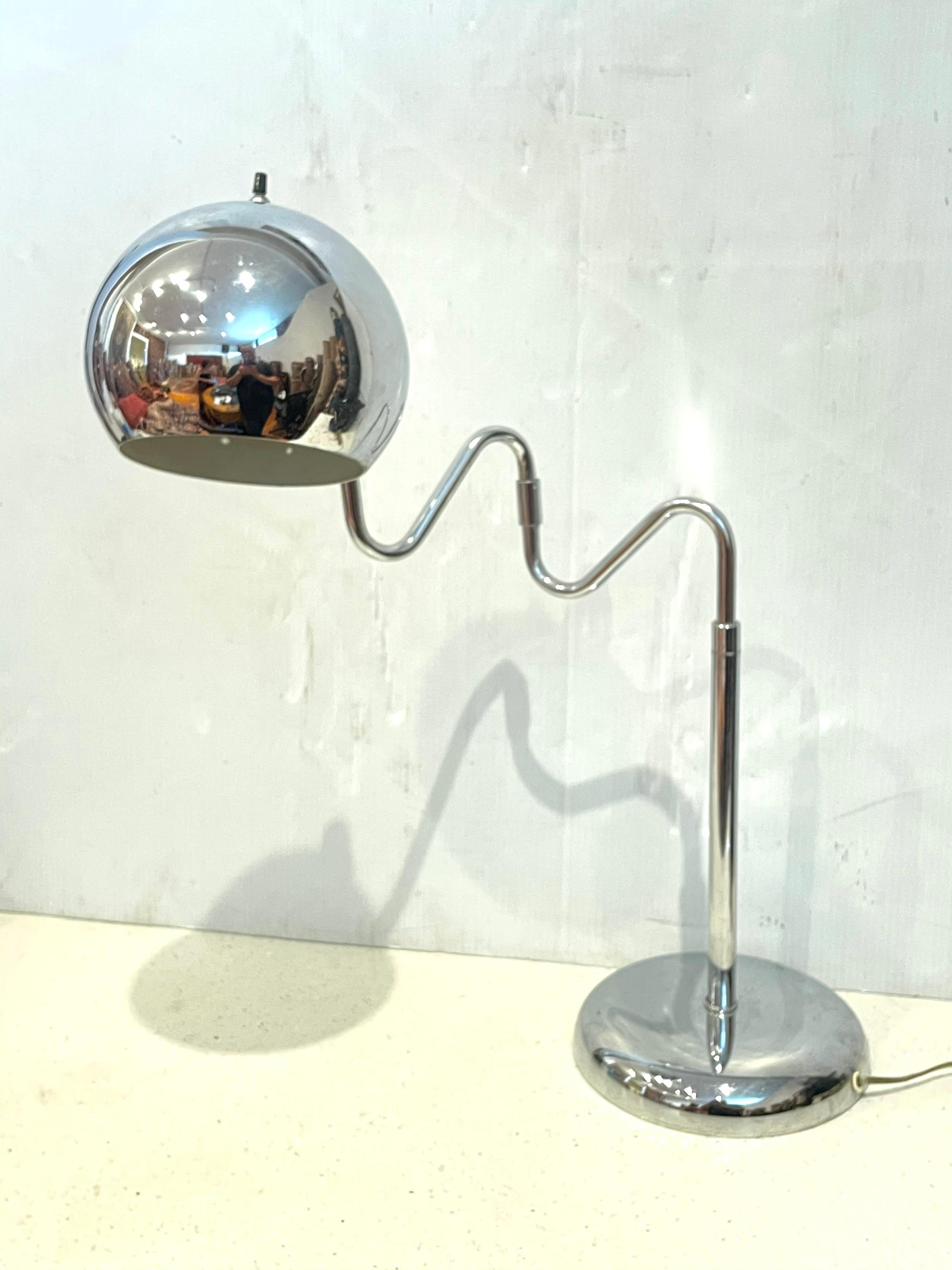 Rare 1970's Space-age table desk lamp by Robert Sonneman, the shade moves up and down and the arm swivels back and forward. We polished and cleaned the lamp its in perfect working condition.