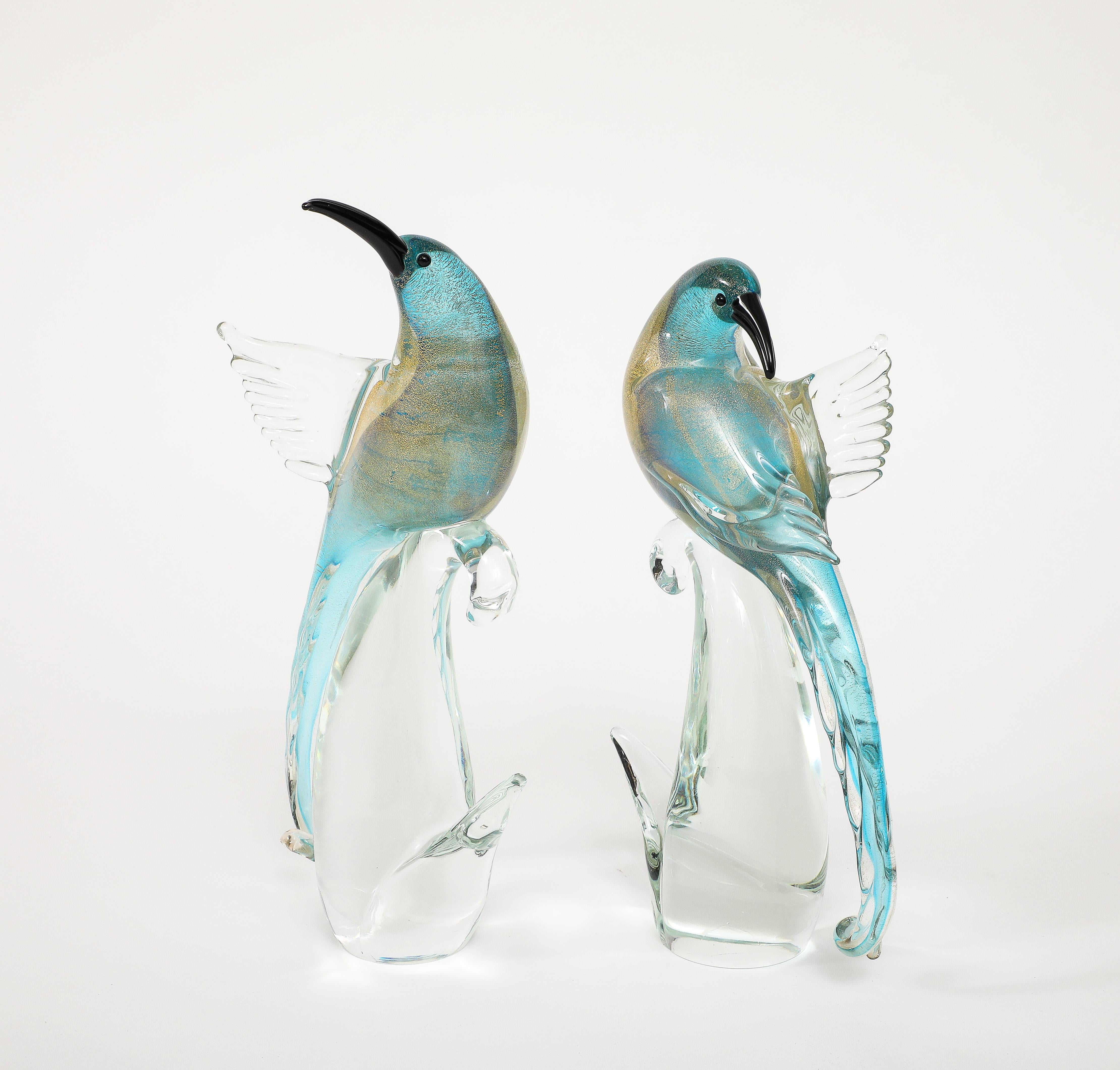 Beautiful pair of 1970's mid-century modern Murano glass birds by Formia Vetri Di Murano, in vintage original condition with minor wear and patina due to age and use.