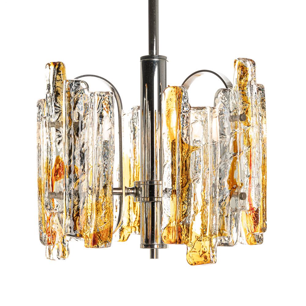 A beautiful pendant with thick bicolor Murano glass fronts. Clear and Amber handblown raw strips and a steel frame.
 