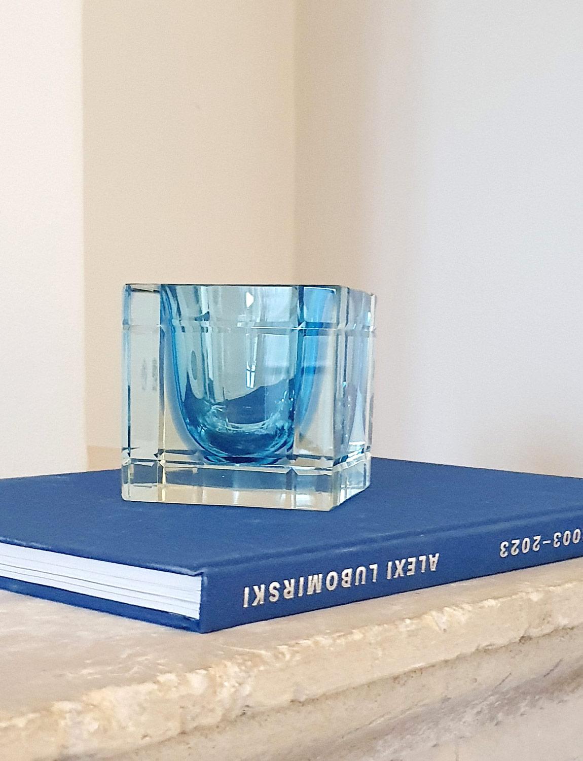 A 1970s Pale blue sommerso (submerged) glass bowl in a cube shape. The cube has decorative ridges on the side and the piece still has its original sticker. Excellent condition.