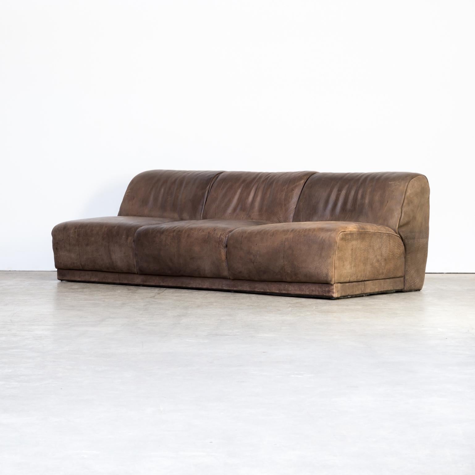 1970s neck leather sofa in the style of De Sede. Sofa in good condition, strong leather, wear consistent with age and use.