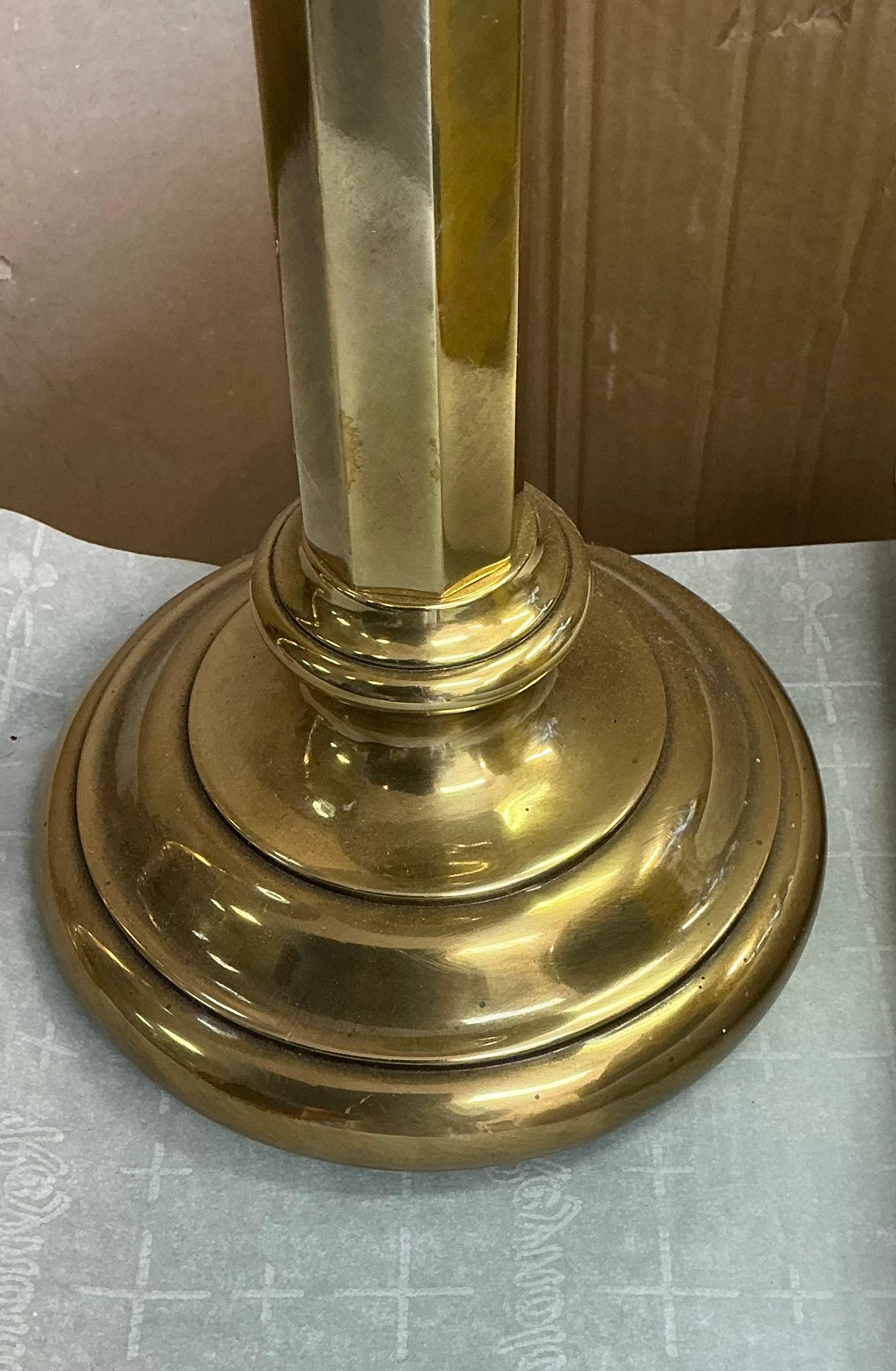 This is a handsome pair of solid brass table lamps by Frederick cooper. It is 23” to the socket. The base is 7” in diameter. The shade base is 13”D with a height of 7”. They are both marked and in very good condition. 