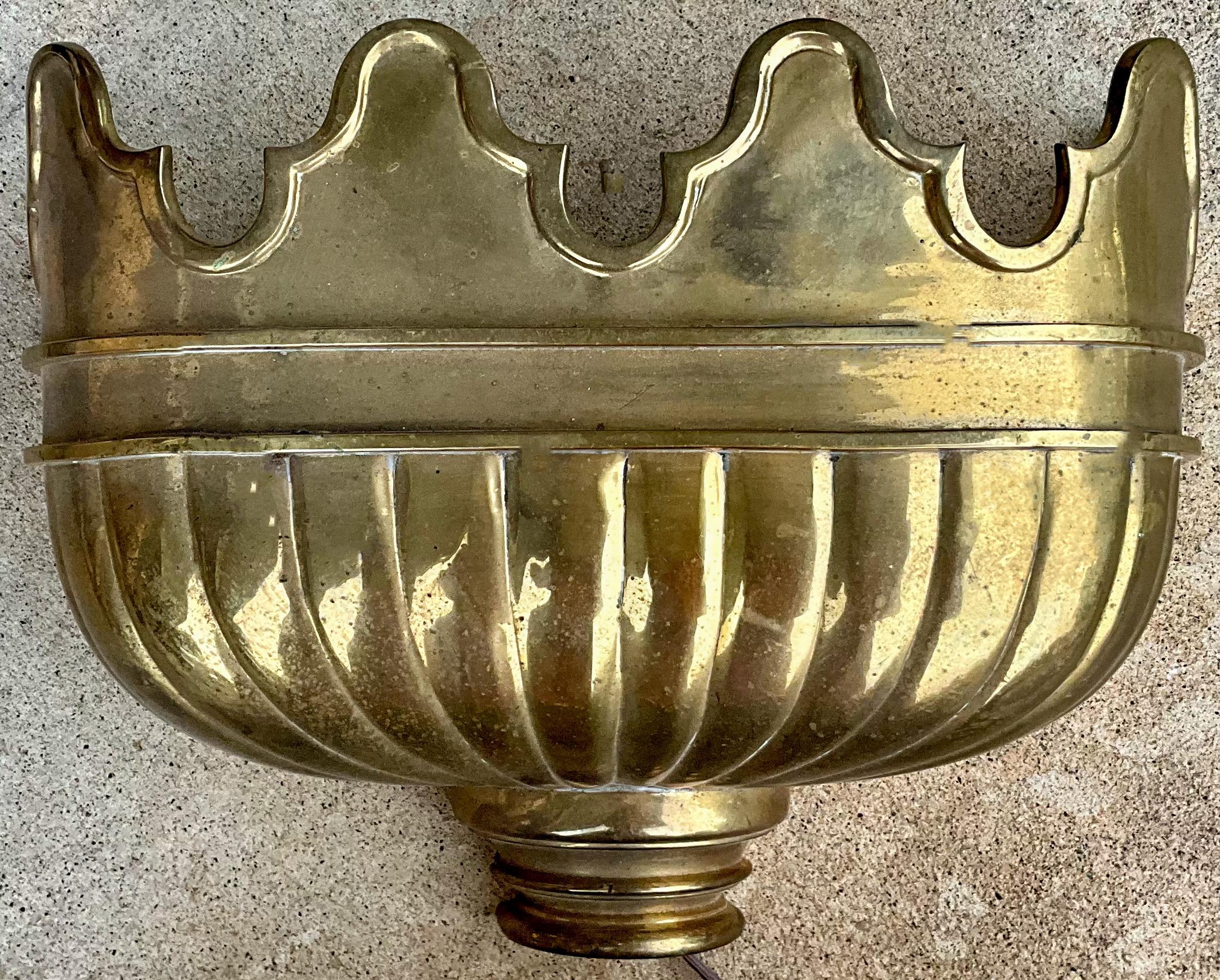 These are striking! It is a pair of solid brass Neo-classical style wall sconces by Chapman. They are in very good condition and in working order. They do have an interior switch and are marked.
