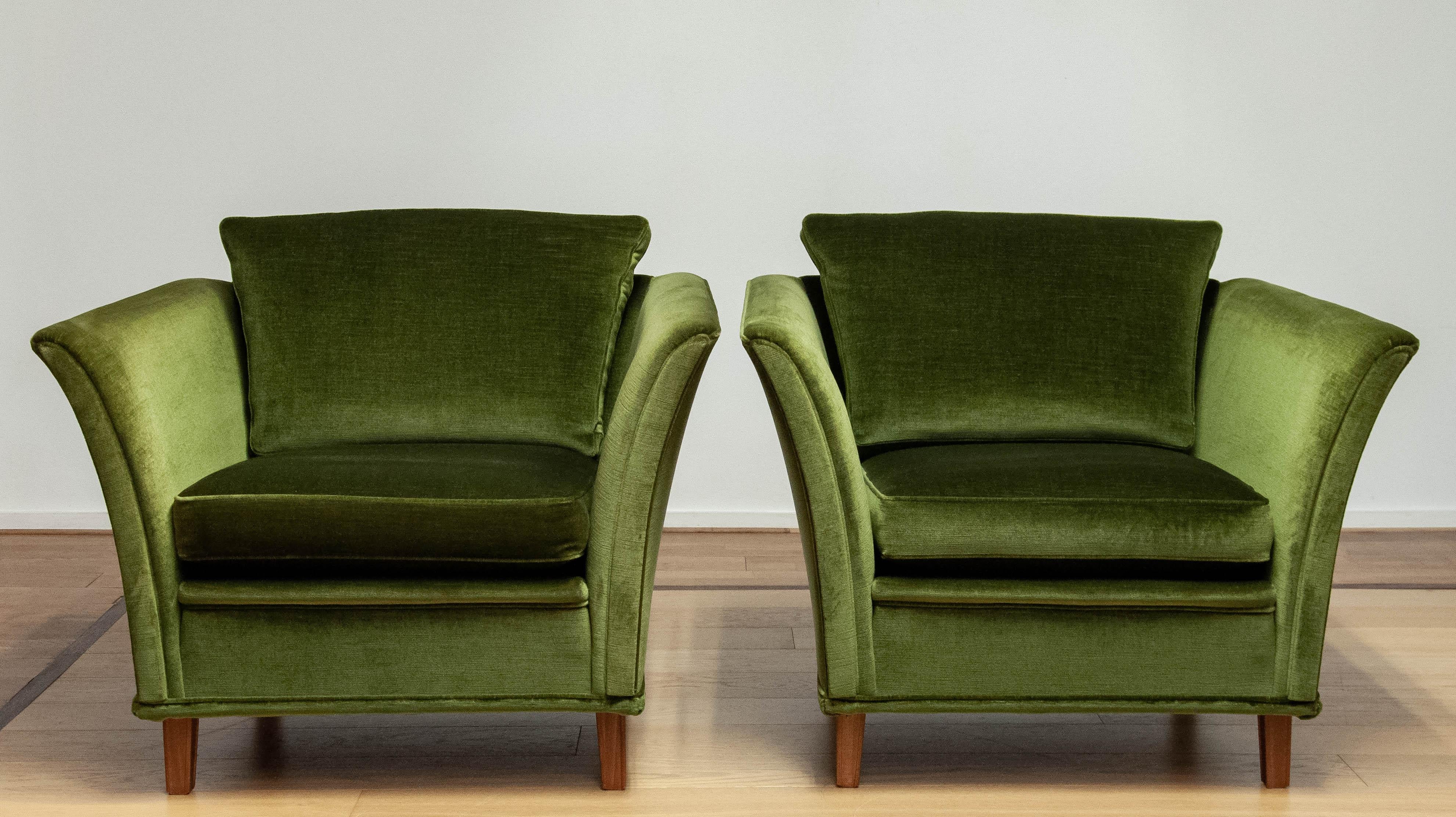 Beautiful neoclassical club chair upholstered with green velvet fabric. The fabric is the original one and stil in very good and clean condition. Allover this chair in in very good condition.