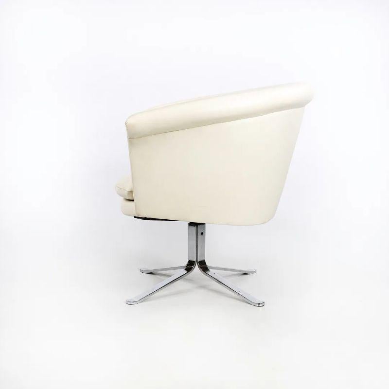 Listed for sale is a single (four chairs are available, though the price listed is for each chair) bucket chair designed by Nicos Zographos and produced by Zographos Designs circa mid 1970s. Each chair was upholstered in white leather and looks to