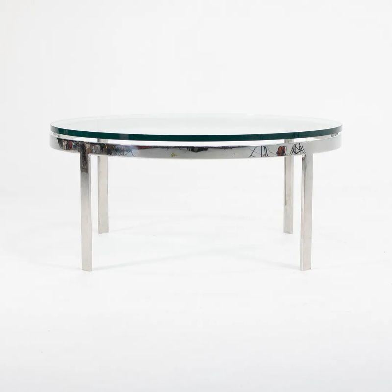 American 1970s Nicos Zographos Round Glass Coffee Table w/ Polished Stainless Steel Base For Sale
