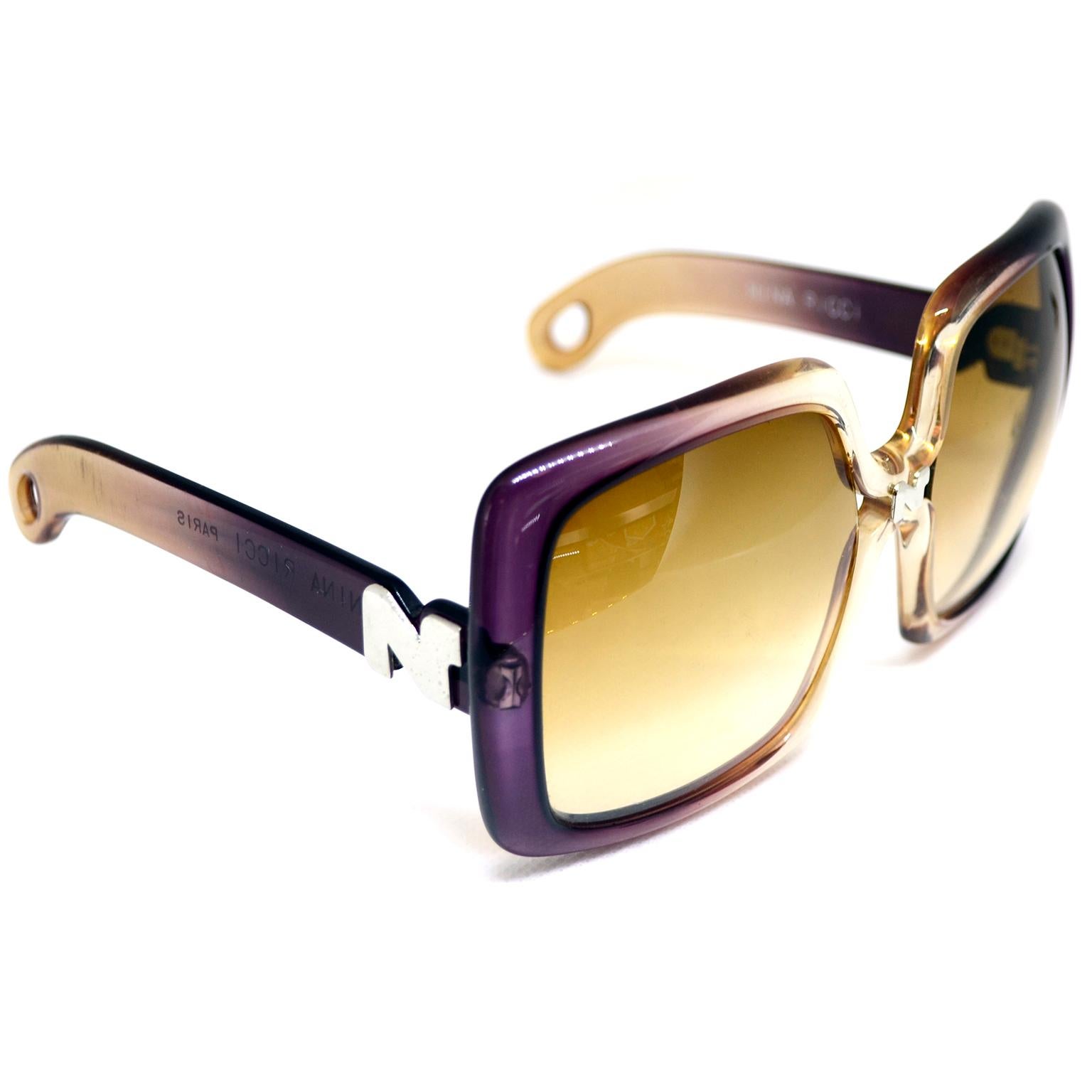 We love these 1970's Nina Ricci Paris vintage sunglasses! The oversized frames graduate from purple to very pale amber.  The Nina Ricci N is on the bridge and on each of the arms. These are marked Nina Ricci Paris and we have included all of the
