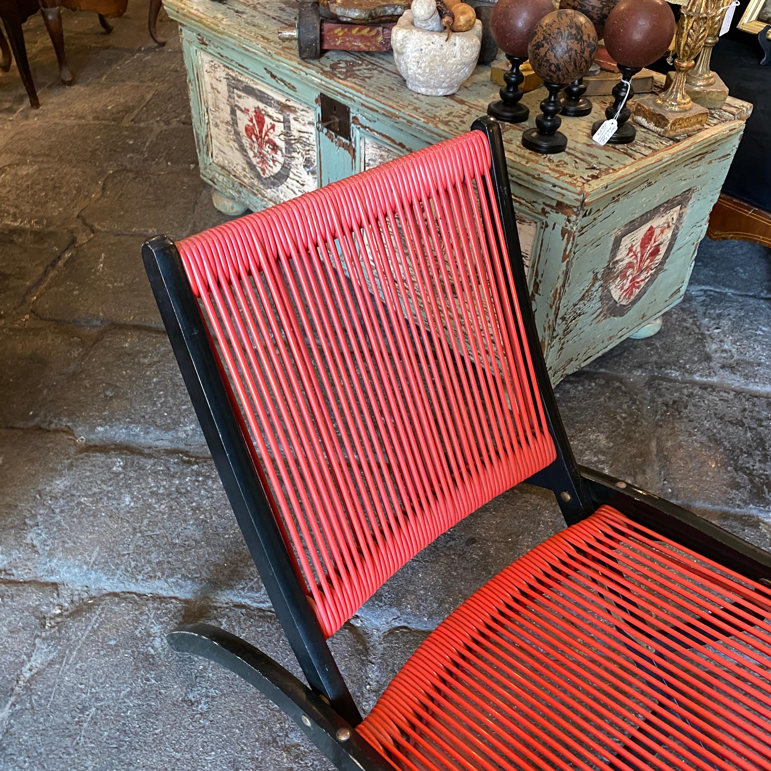 A. wood and red plastic folding armchair designed by Giò Ponti for Reguitti. It's in original conditions, red plastic it's in perfect conditions. Ninfea chair is published with Certificate from Ponti Archive.
    
