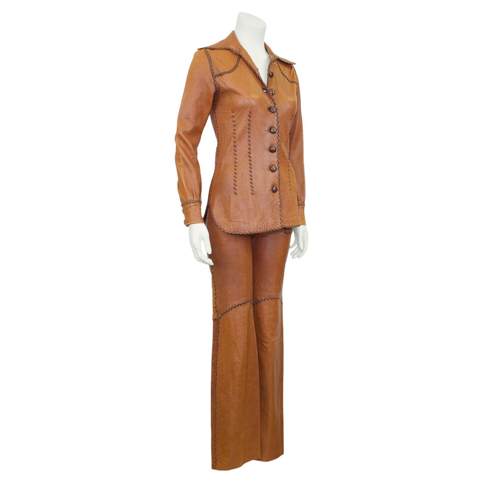 This is the iconic dream set for fans of Daisy Jones and the Six. Late 60's early 70's walnut brown North Beach Leather whipstitched shirt and matching sailor front bell bottoms. Nothing beats the hand made quality of these early pieces stitched in