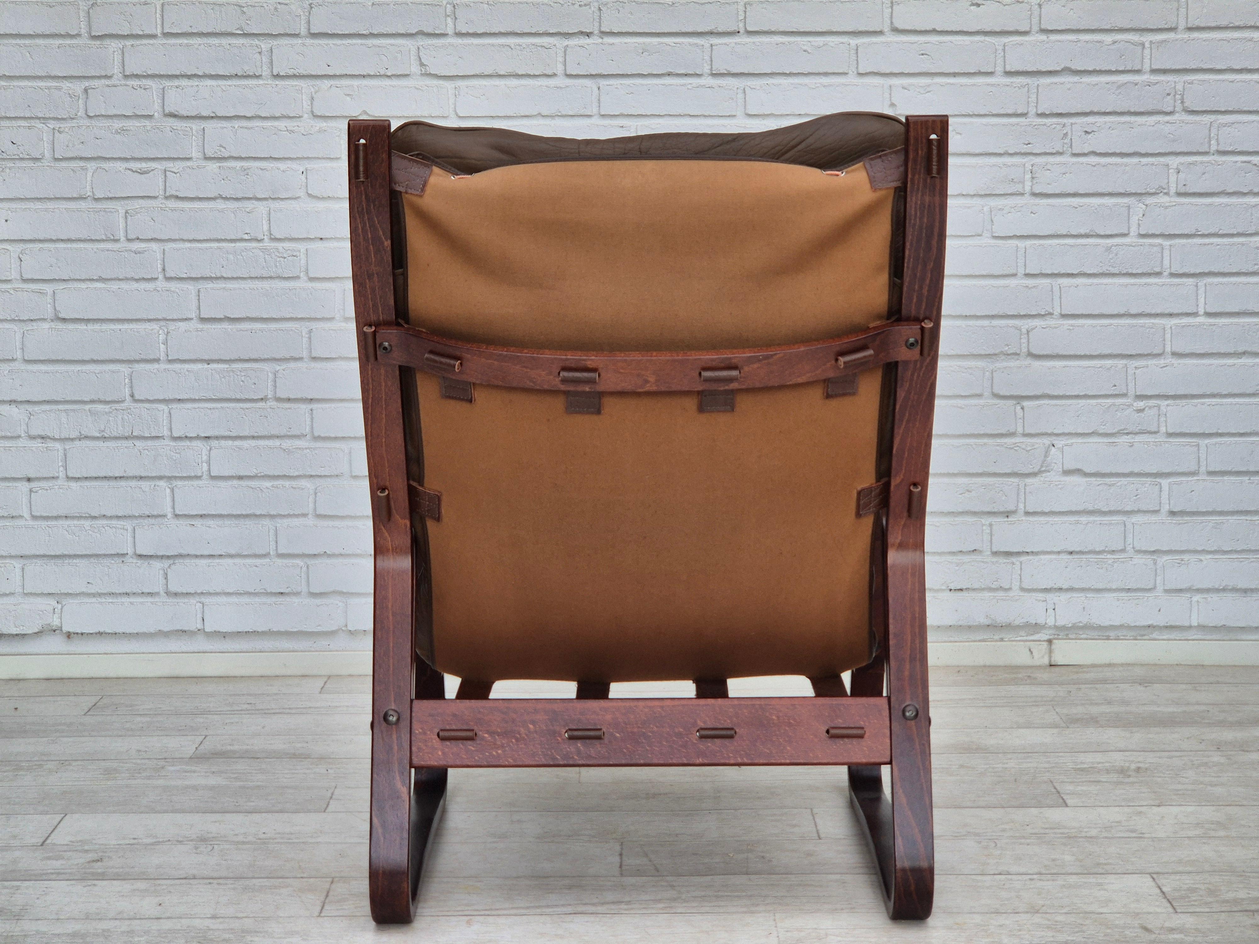 Leather 1970s, Norwegian design, lounge chair with footstool, original condition. For Sale
