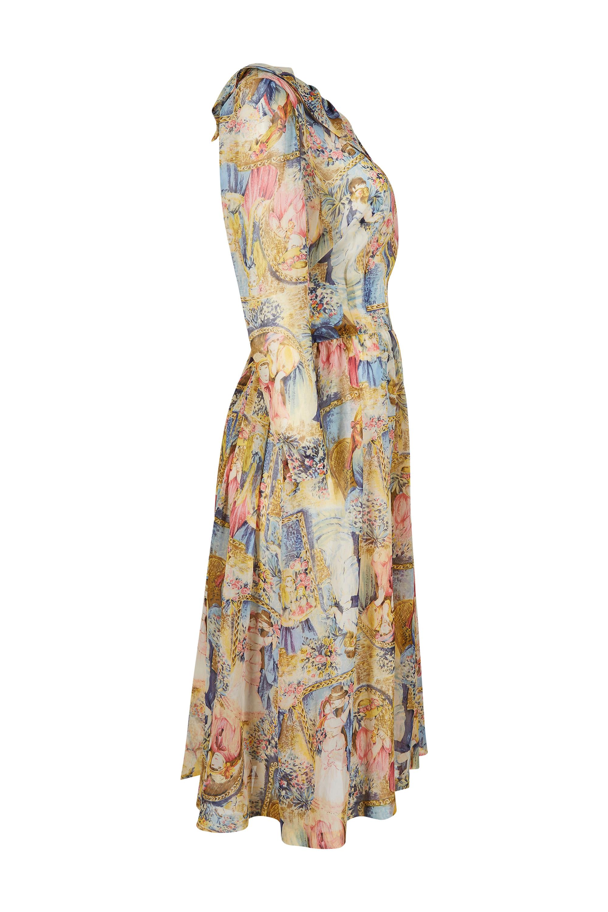 This charming 1970s printed chiffon dress is unlabelled however it is exceptionally pretty with a unique novelty print depicting romantic images of wistful young girls and courting lovers amidst floral settings. The colours are soft pastel shades of