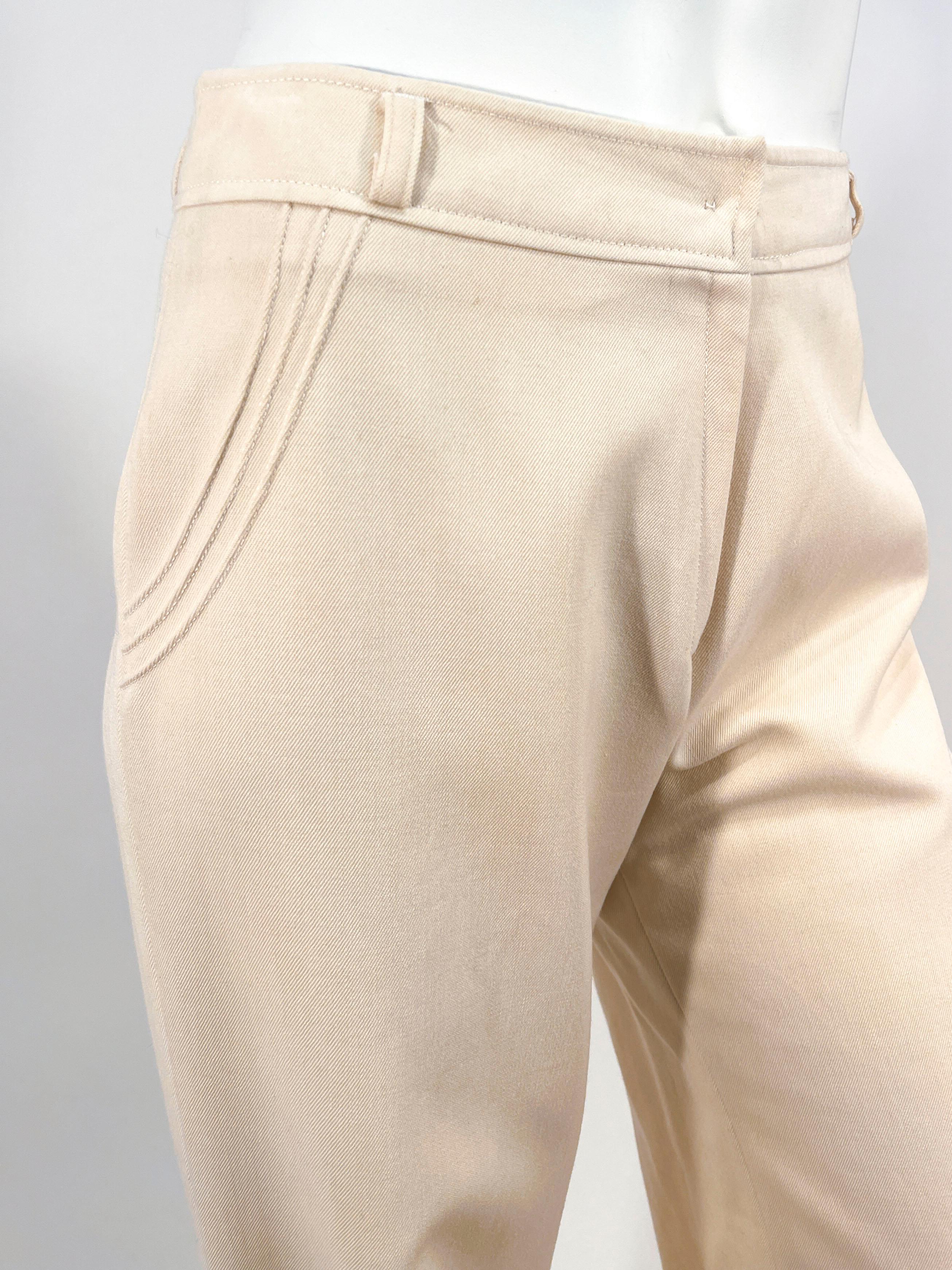 1970s custom made off-white bellbottom pants with faux pocket pin pleats. These are high waisted with belt loops and zip fly. The legs are very wide legged and the textile is a wool blend. 