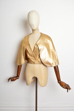 Giacca Oliver of London anni '70 in pelle metallizzata dorata - Capo Glam Rock