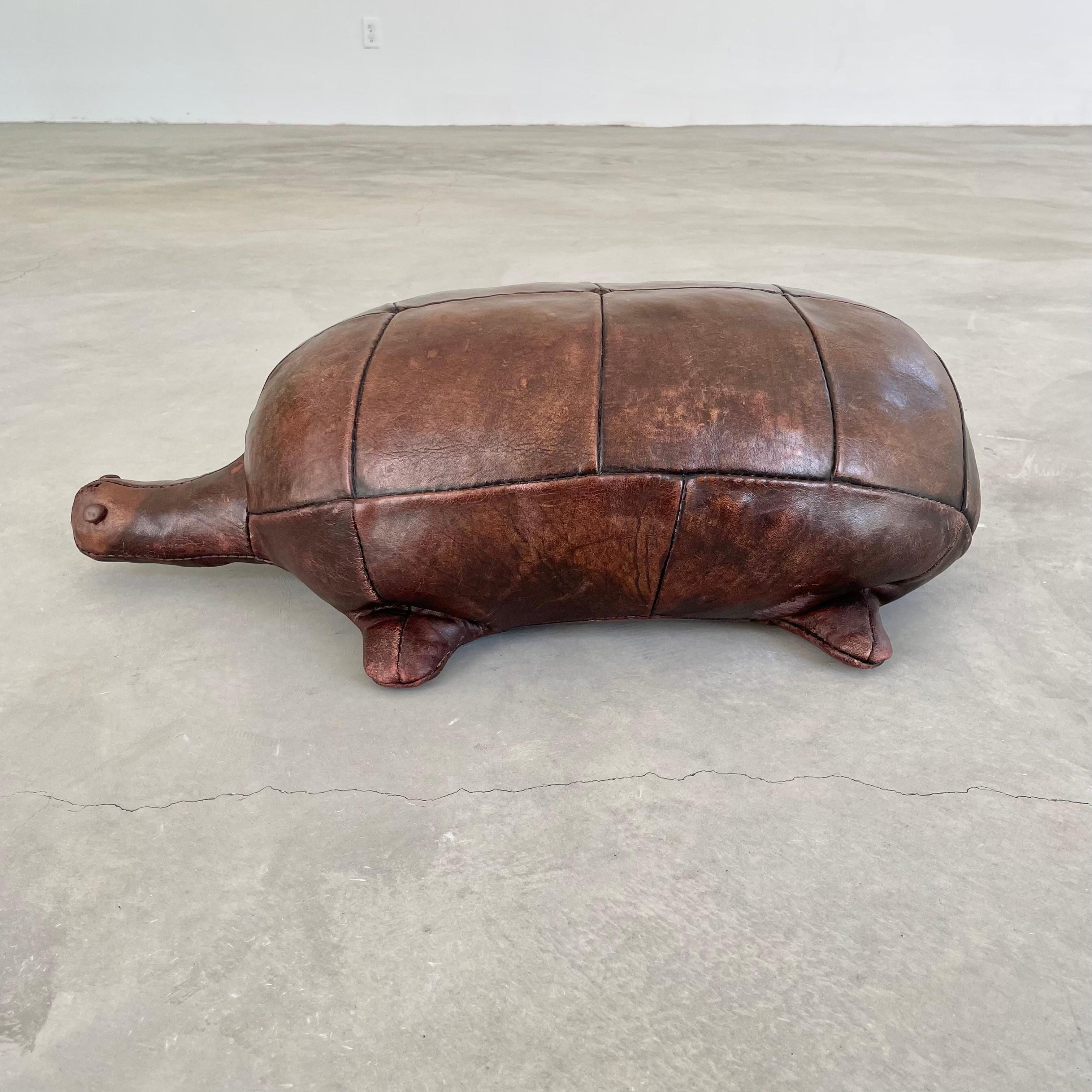 Rare leather turtle by Omersa. Functional stool or foot rest for an adult or child. Made in England, Circa 1970s. Beautiful vintage coloring and patina. Wear as shown. Great sculptural piece. 



