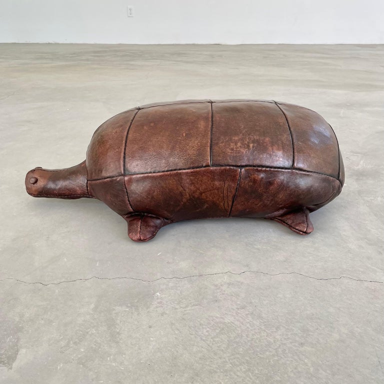 Rare leather turtle by Omersa. Functional stool or foot rest for an adult or child. Made in England, Circa 1970s. Beautiful vintage coloring and patina. Wear as shown. Great sculptural piece. 



