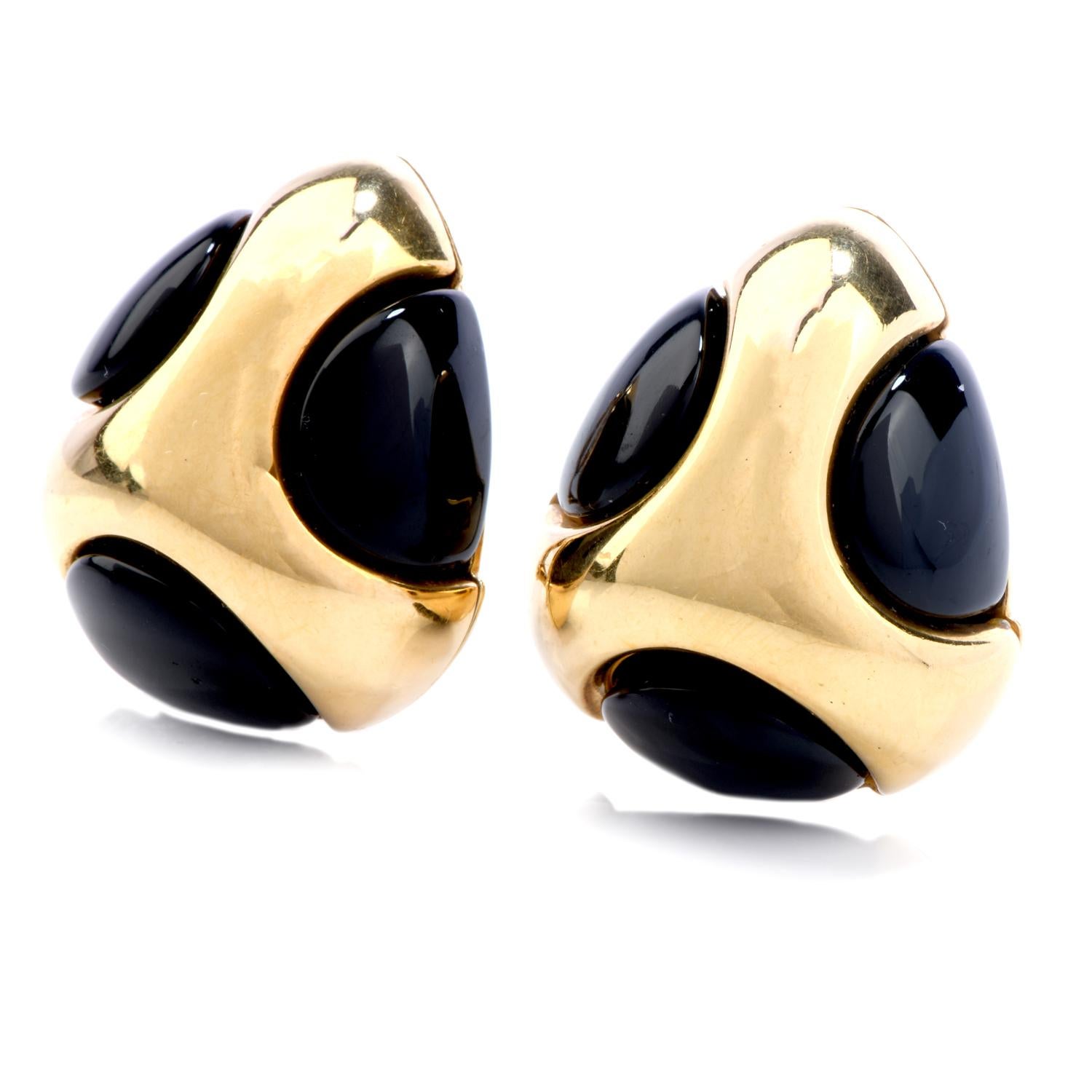 Wear this chic and fashionable Vintage 1970's Onyx 18K Gold Polka Dot Tear Drop Clip On Earrings the next time you venture into the city! 

These earrings are crafted in quality 18 karat yellow gold.  There are six black genuine onyx circle motifs