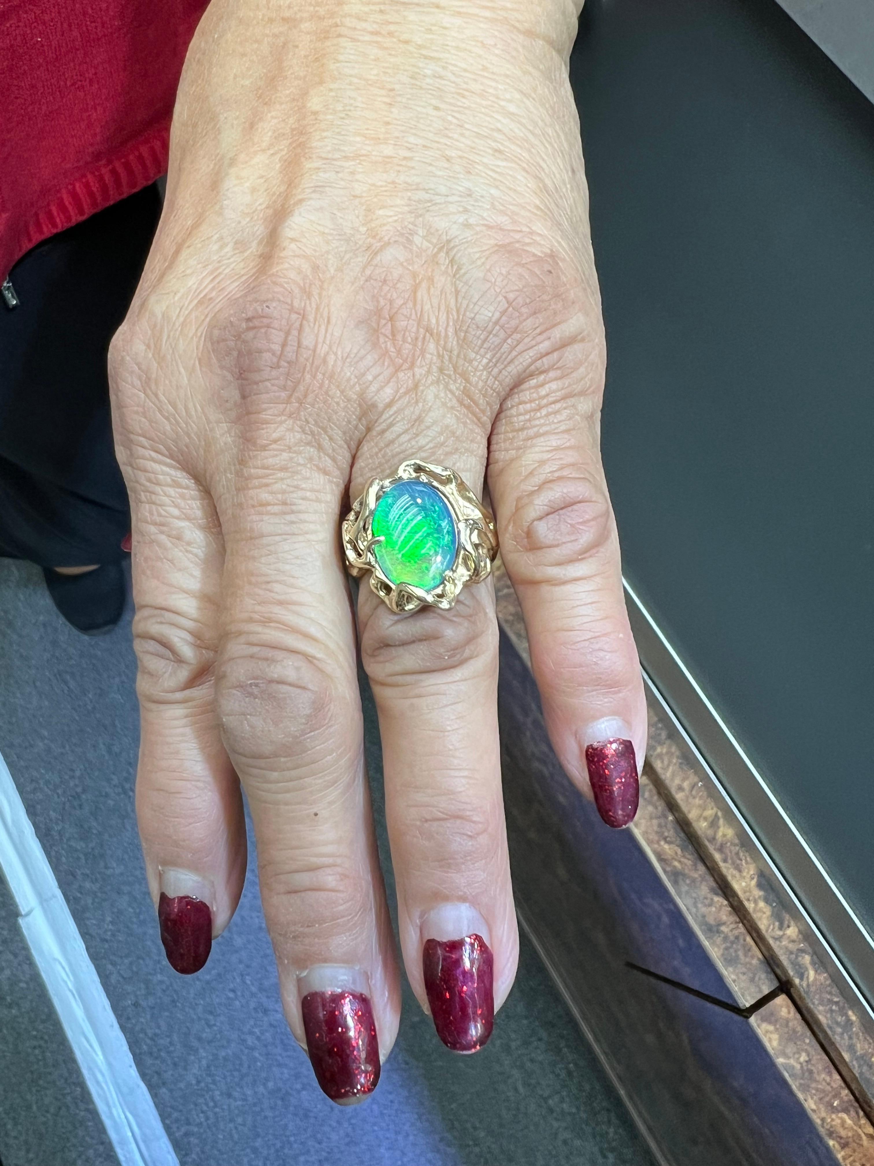 1970s Opal doublet freeform designed 14k yellow gold ring.

The Opal Doublet freeform designed 14k yellow gold ring from the 1970s is a fine example of a one-of-a-kind ring from this period.  The opal has flashes of blue and green as one rotates the