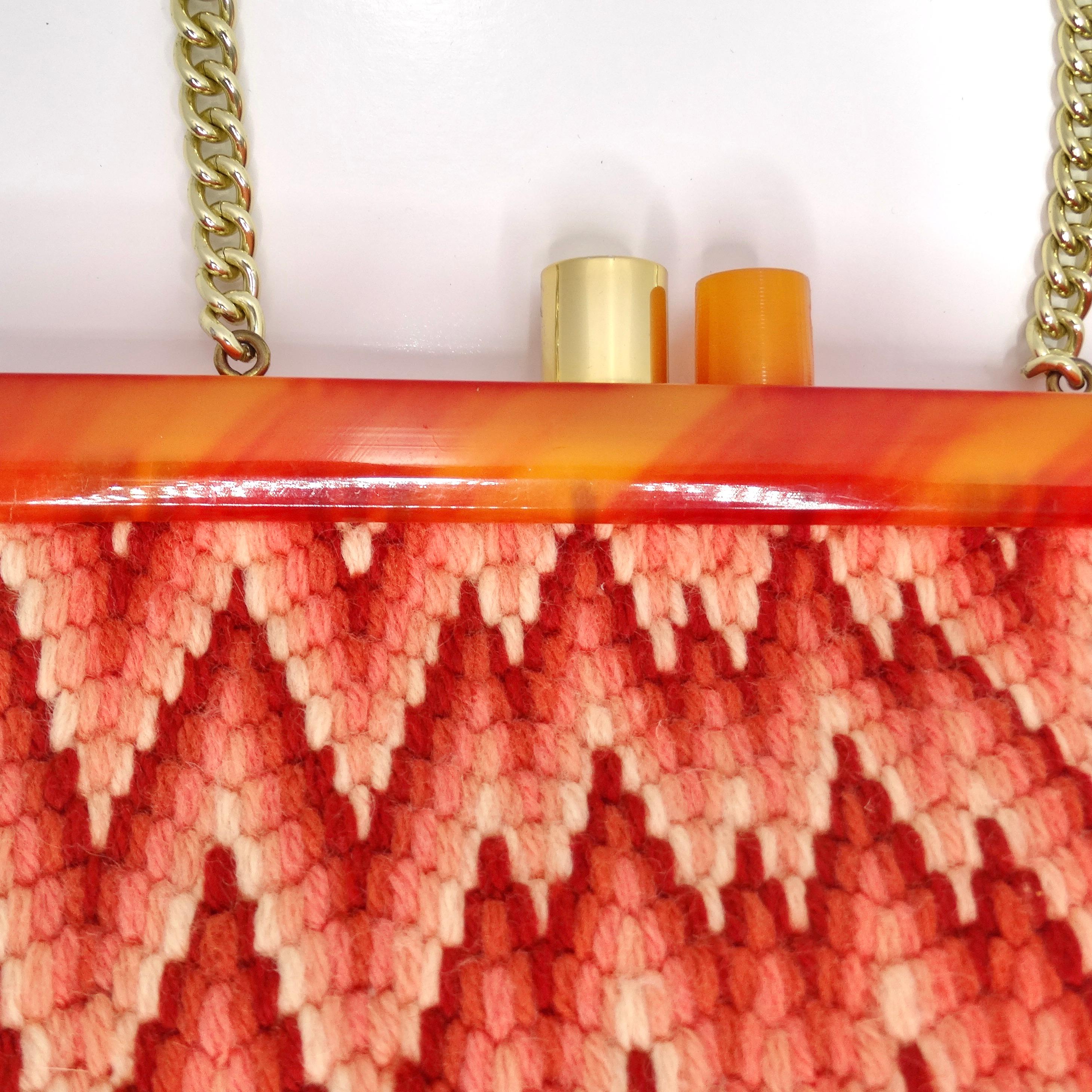 Step into the retro chic of the 1970s with the Orange Knit Shoulder Bag – a vibrant and fun accessory that adds a pop of color to your ensemble. This knitted shoulder bag showcases a gradient burnt orange and peach chevron print, creating a playful