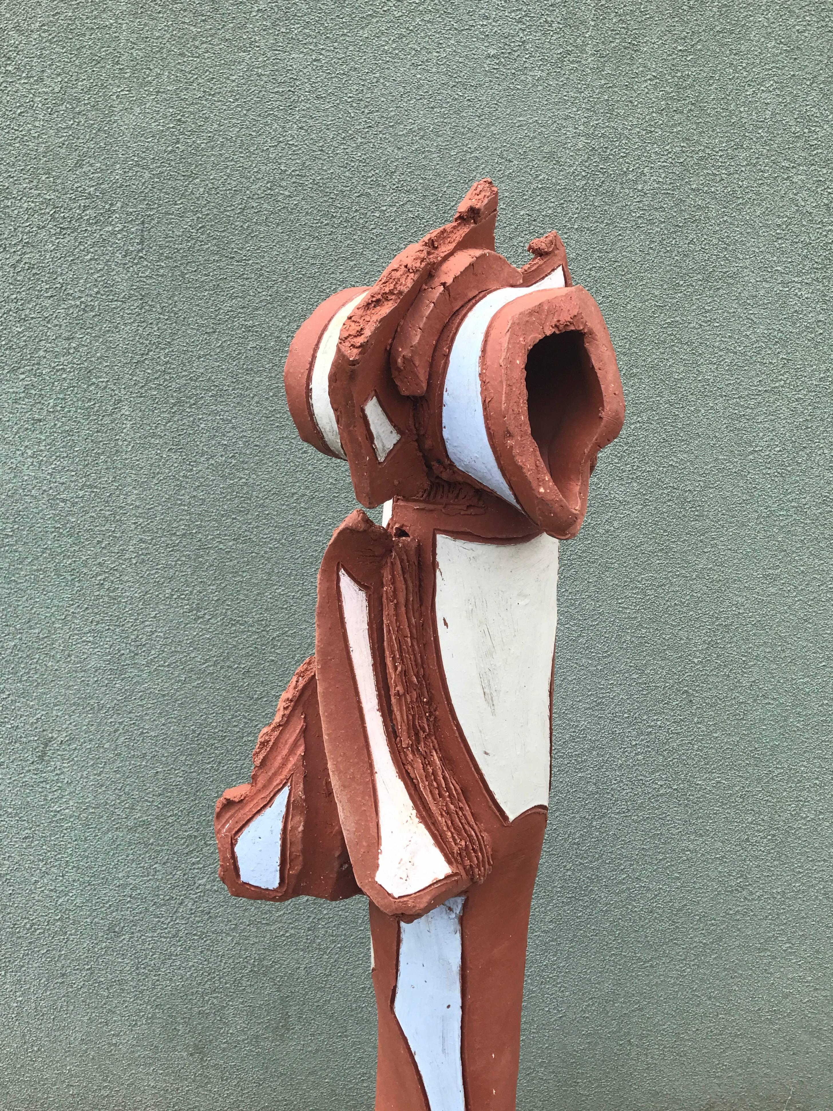 Large abstract form ceramic garden totem with areas of applied white glaze to the red clay body. Placed on a concrete base 16