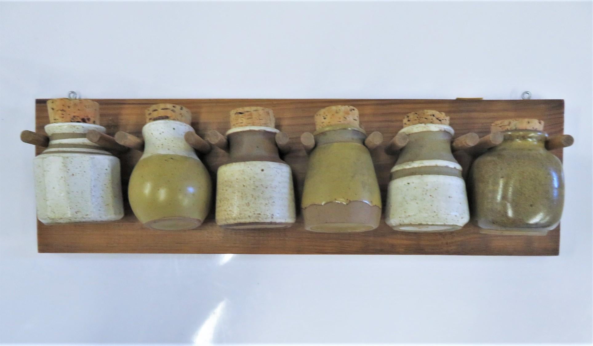 1970s Organic Modern Kitchen Wall Spice Rack with Pottery Jars Cork Tops In Good Condition In Miami, FL