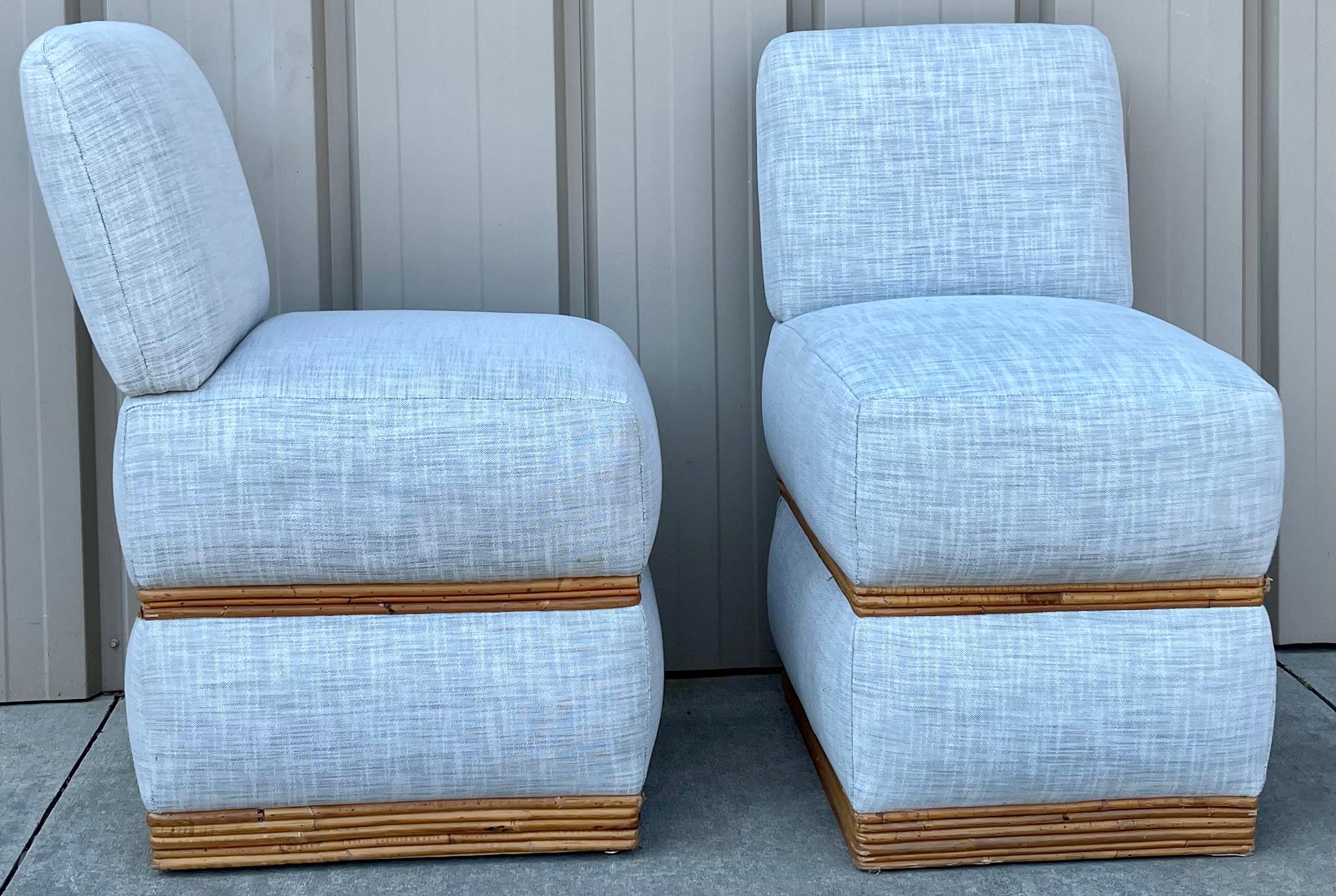 These have a great look! It is a pair of organic modern pencil bamboo and linen slipper chairs with pencil bamboo accents. The fabric is a blue gray linen.