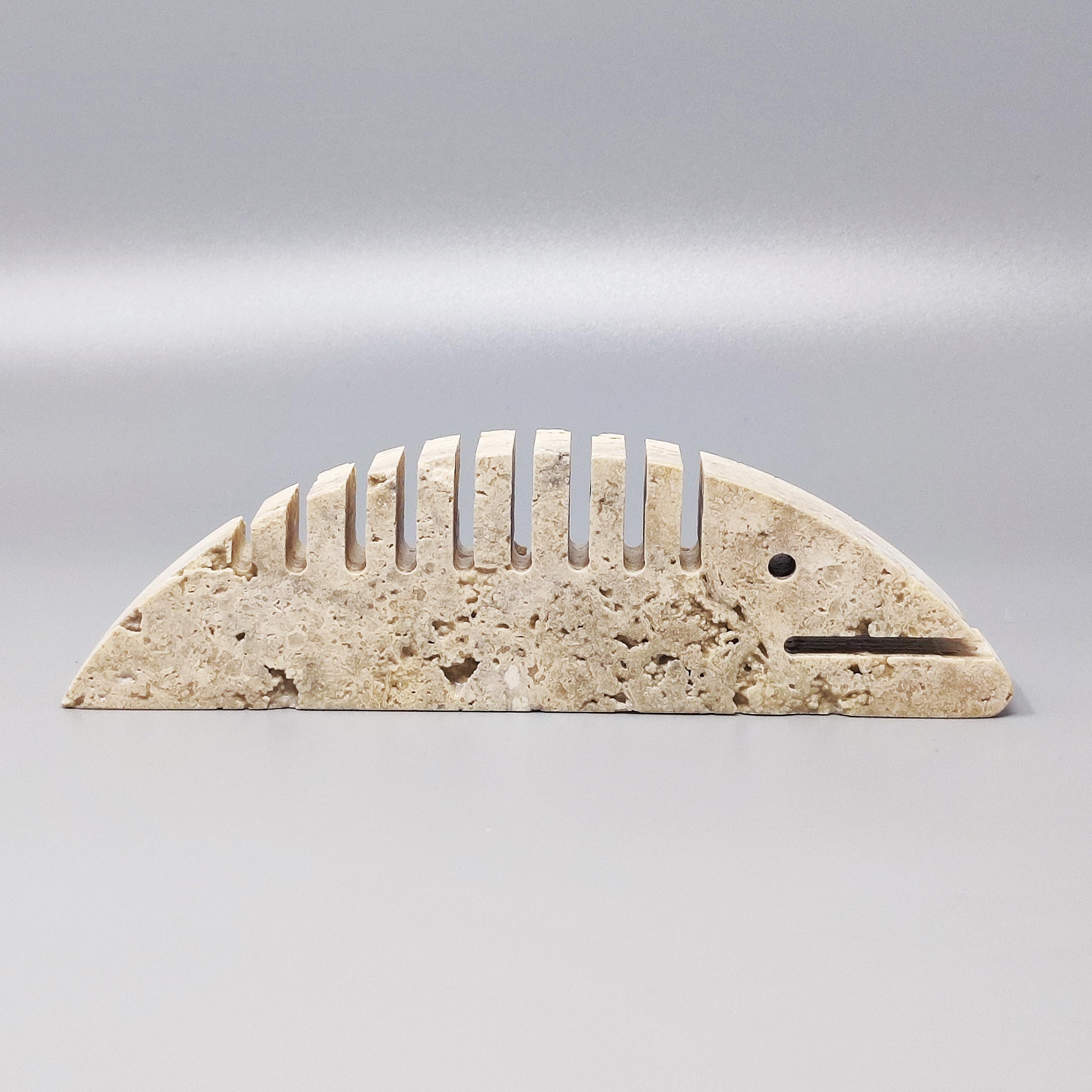 1970s Original big travertine fish sculpture by F.lli Mannelli. The item is in excellent condition. Made in Italy.
Dimension:
8,26 w x 1,18 D x 2,36H inches
L 21 cm x P 3 cm x cm 6 H.