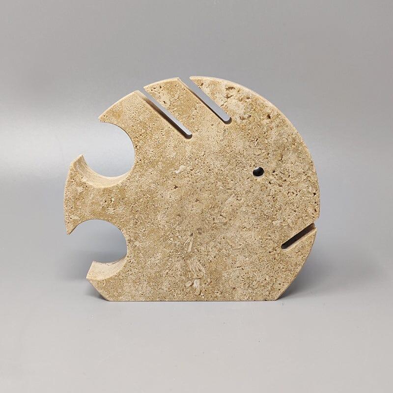 1970s Original large travertine fish sculpture by Enzo Mari for F.lli Mannelli. The item is in excellent condition. Made in Italy.
Dimension:
5,90 w x 1,18 D x 5,51 H inches
L 15 cm x P 3 cm x cm 14 H.