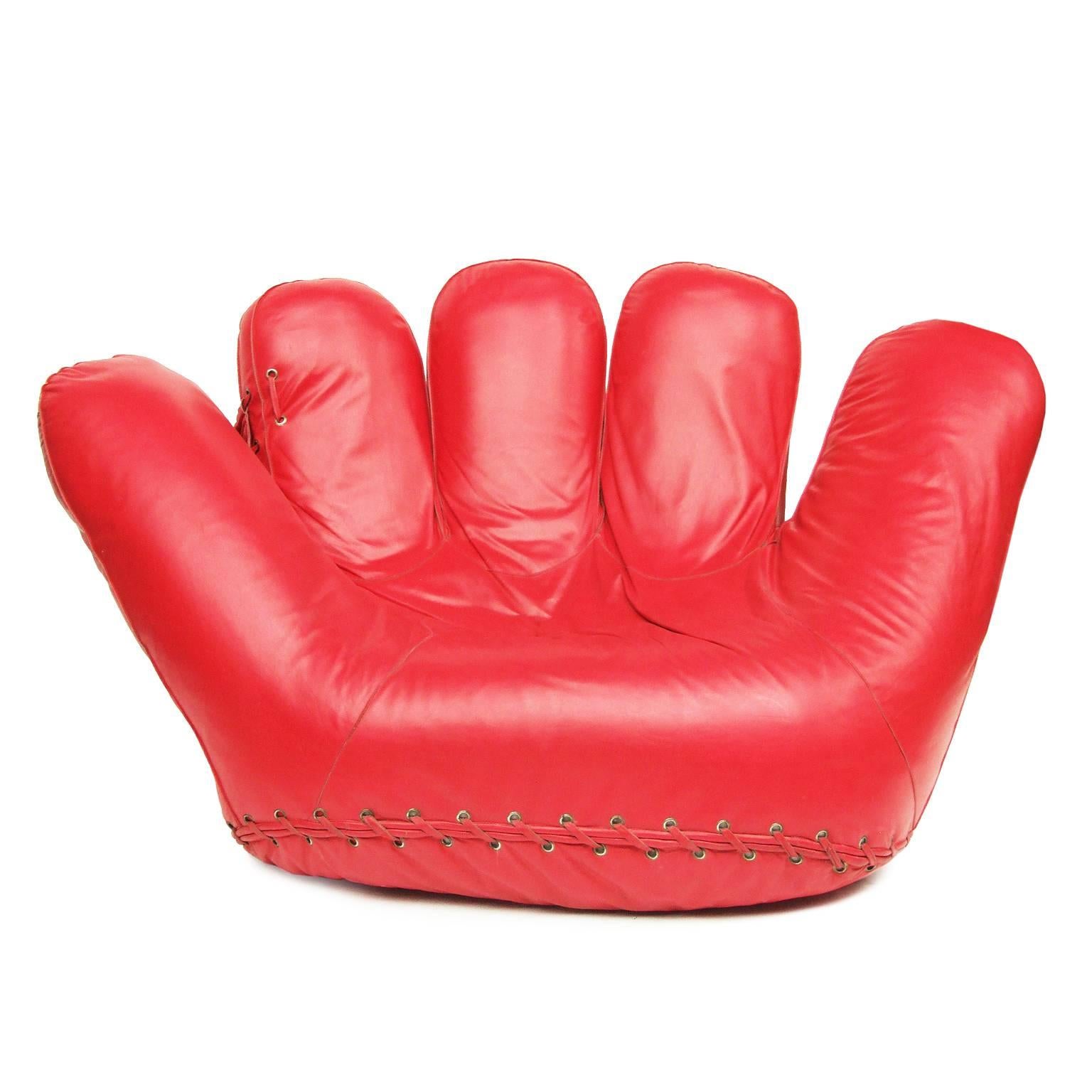 Baseball glove seat designed by Jonathan de Pas, Donato D'urbino and Paolo Lomazzi for Poltronova, Italy, 1970.

Polyurethane foam construction upholstered in rare red leather with brass eyelets. Four castors.

1980s edition.

Measures: H 86