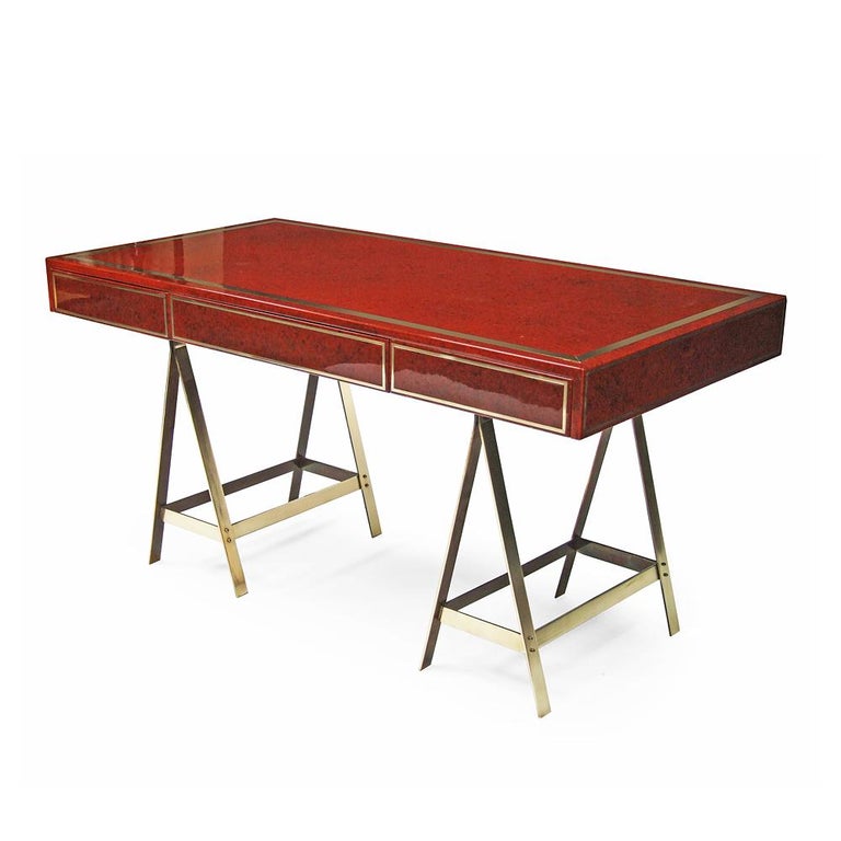 1970s desk attributed to Albrizzi with a design by Lacquersmith, USA.

Pattern tinted lacquer console with brass inlay and two matching solid brass trestle supports.

Three drawers.

Measure: H 79cm x L 152.5cm x W 76.5cm.