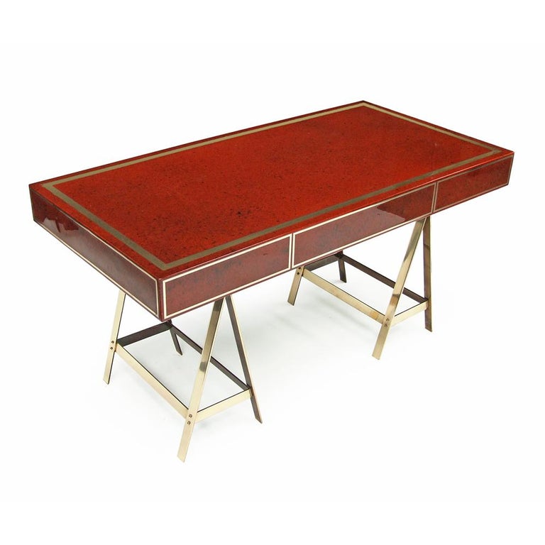 Hollywood Regency 1970s Original Red Lacquered Albrizzi Desk with Brass Trestle Legs and Inlay For Sale