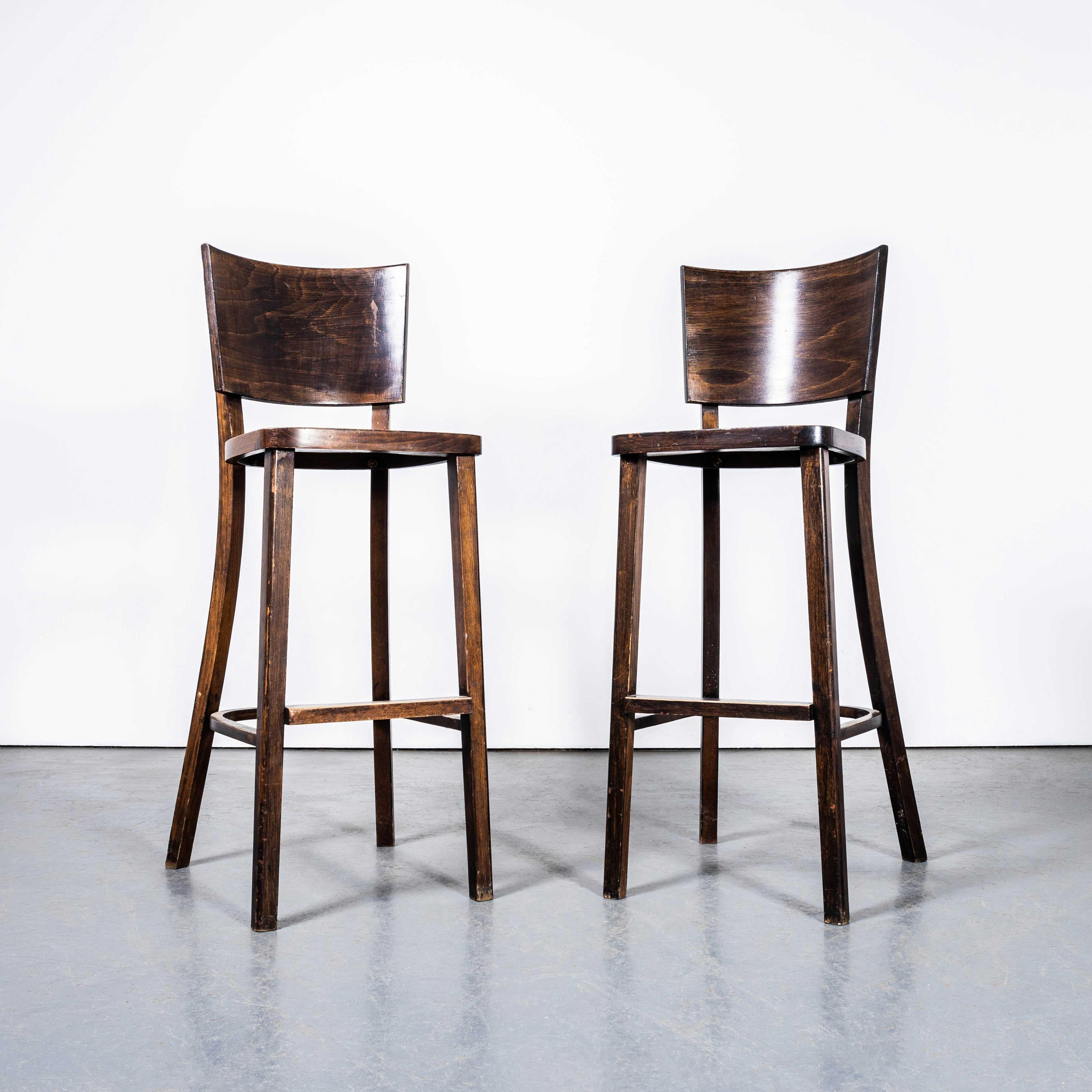 1970’s Original Tall Backed Bentwood Bar Chairs – Pair. 

Good quality classic bentwood bar chairs with a typical 70's deep back design. The chairs were made in Eastern Europe using solid steam bent beech, they are a rich dark walnut colour with a