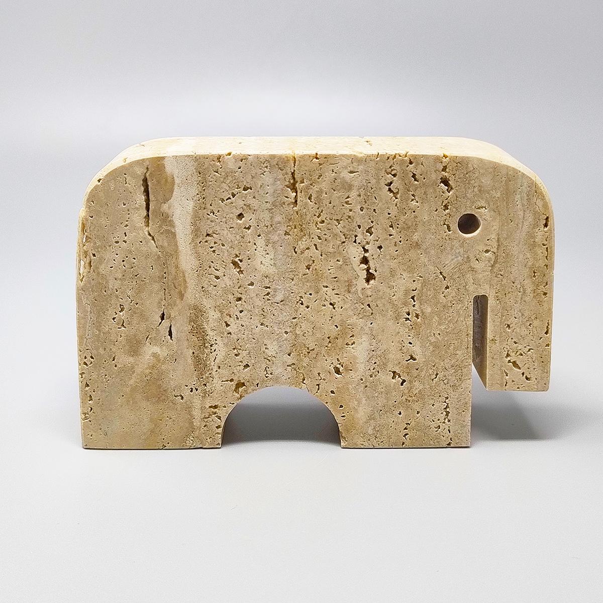 1970s Original big travertine elephant sculpture by Enzo Mari for F.lli Mannelli. The item is in excellent condition. Made in Italy.
Dimension:
5,51 w x 1,18 D x 3,93 H inches
L 14 cm x P 3 cm x cm 10 H

.