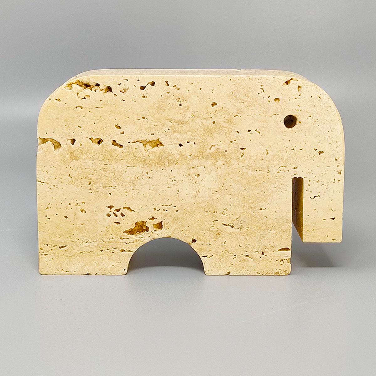 1970s Original big travertine elephant sculpture by Enzo Mari for F.lli Mannelli. The item is in excellent condition. Made in Italy.
Dimension:
5,51 w x 1,18 D x 3,93 H inches
L 14 cm x P 3 cm x cm 10 H

.