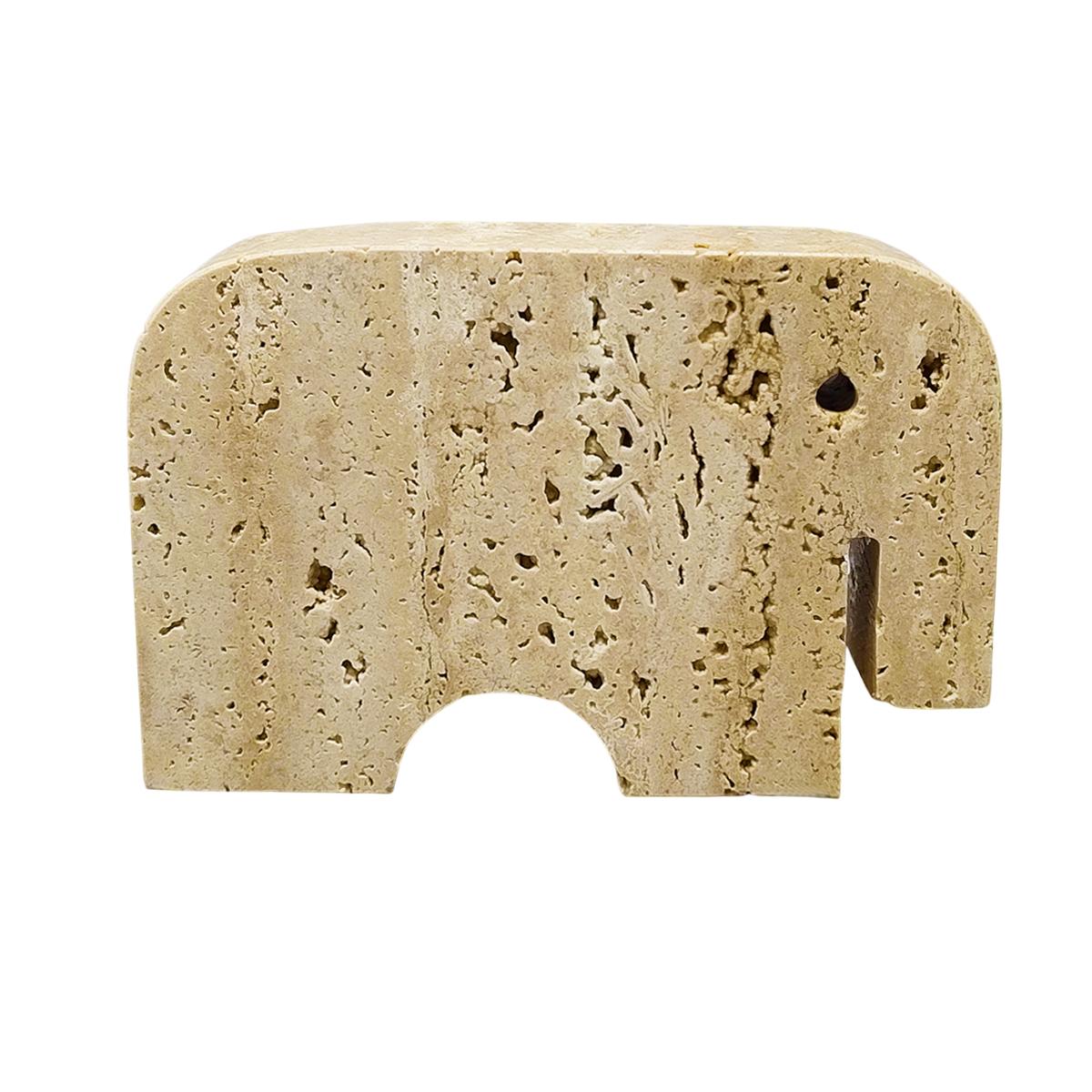 1970s Original big travertine elephant sculpture by F.lli Mannelli. The item is in excellent condition. Made in Italy.
Dimension:
5,51 w x 1,18 D x 3,93 H inches
L 14 cm x P 3 cm x cm 10 H

.