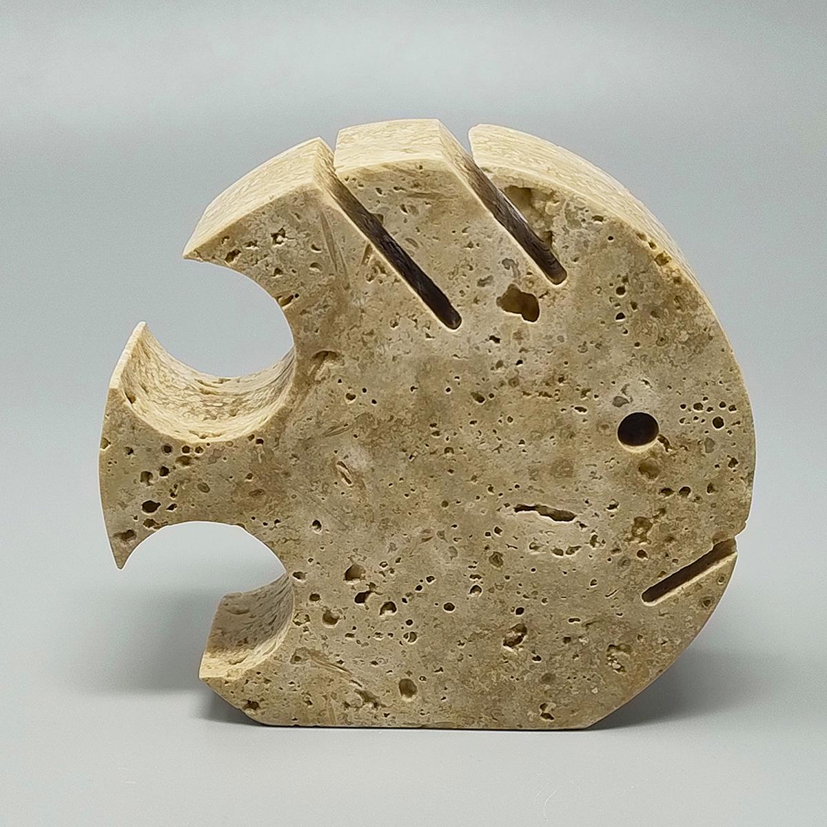 1970s Original big travertine fish sculpture by Enzo Mari for F.lli Mannelli. The item is in excellent condition. Made in Italy.
Dimension:
4,33 w x 1,18 D x 3,93 H inches
L 11 cm x P 3 cm x cm 10 H

.