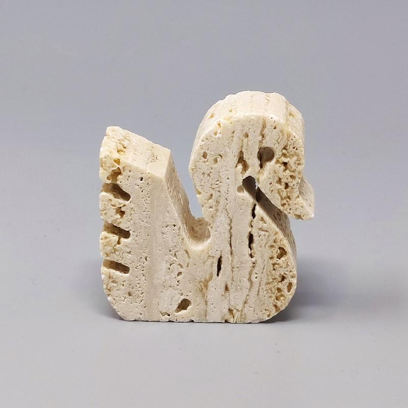 1970s Original travertine swan sculpture by F.lli Mannelli.
The item is in excellent condition. Made in Italy.
Dimension:
2.36 w x 0.78 D x 1.96 H inches
L 6 cm x P 2 cm x cm 5 H.

.
