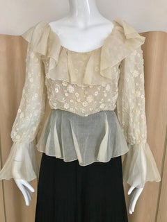 Mono de seda plisada negra y crema Oscar De La Renta, años 70