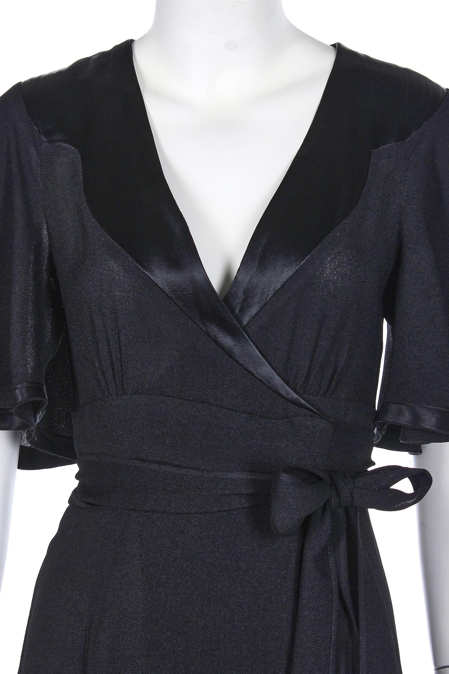1970's Ossie Clark for Radley moss crepe black flutter sleeve wrap dress with satin trim. In excellent condition.

Shoulders: approx. 13”
Bust: 32”
Waist: 25”-26”
Hips: 39”
Bodice length: 15”
Skirt Length: 42”