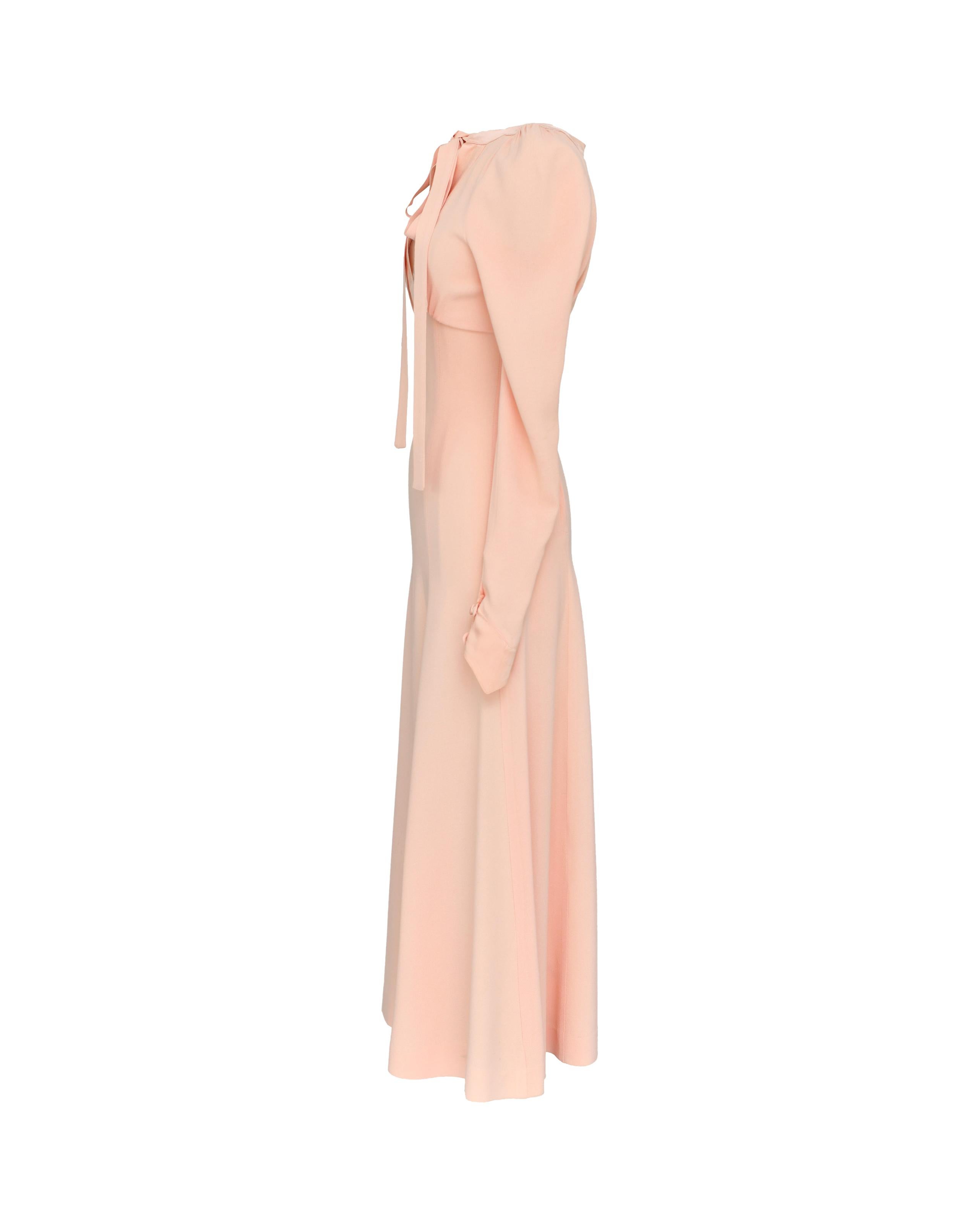 1970's Ossie Clark for Radley cotton candy pink crepe dress with silk tie front. Open back cutout and concealed side zip closure. Literally 'topped with a bow' silk trim and unique pointed silk cuffs. 