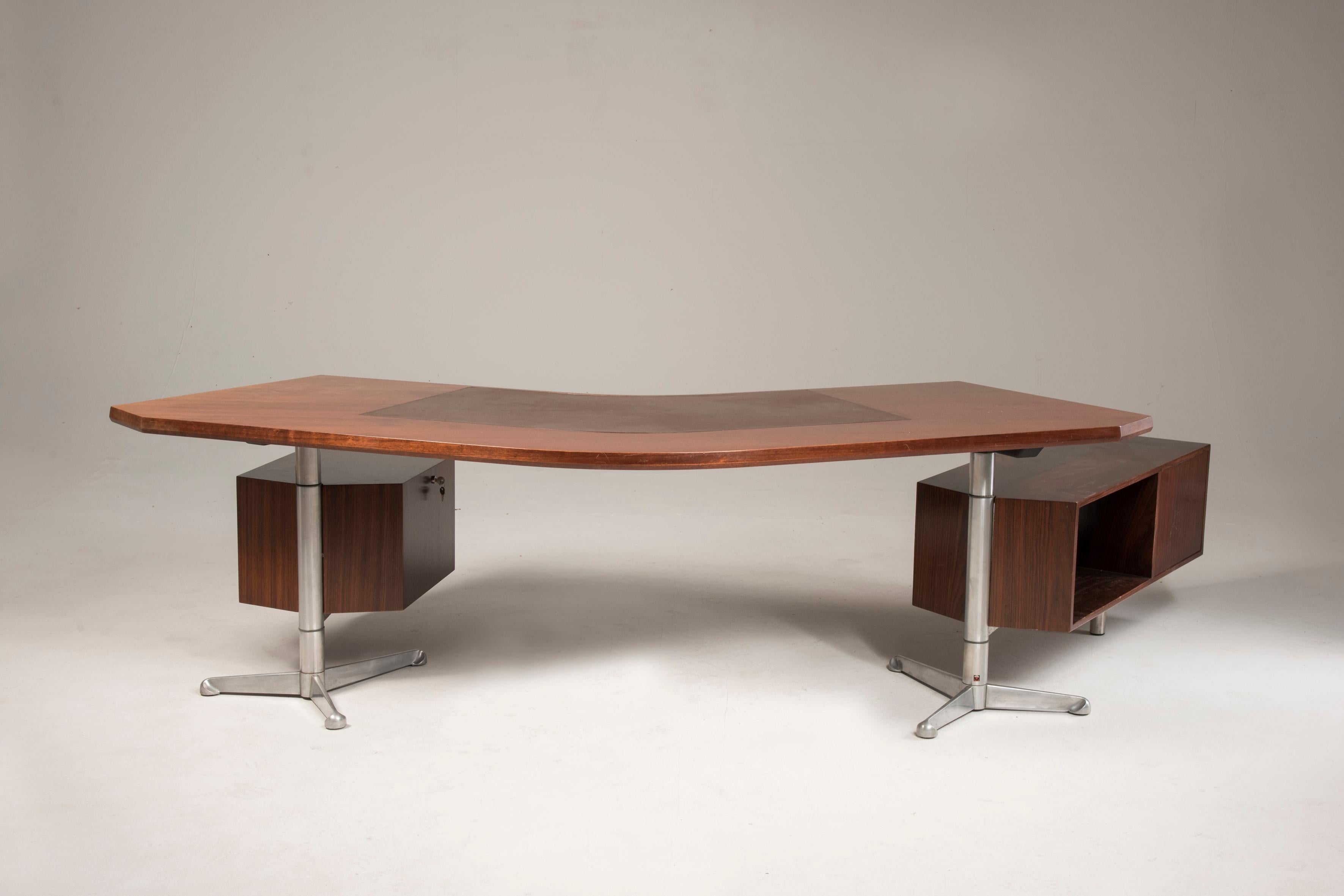 This large executive desk model T96 was designed by Osvaldo Borsani in 1956  and produced by Tecno in Milan, Italy. This pieces features original tags from Tecno production and shows a 
